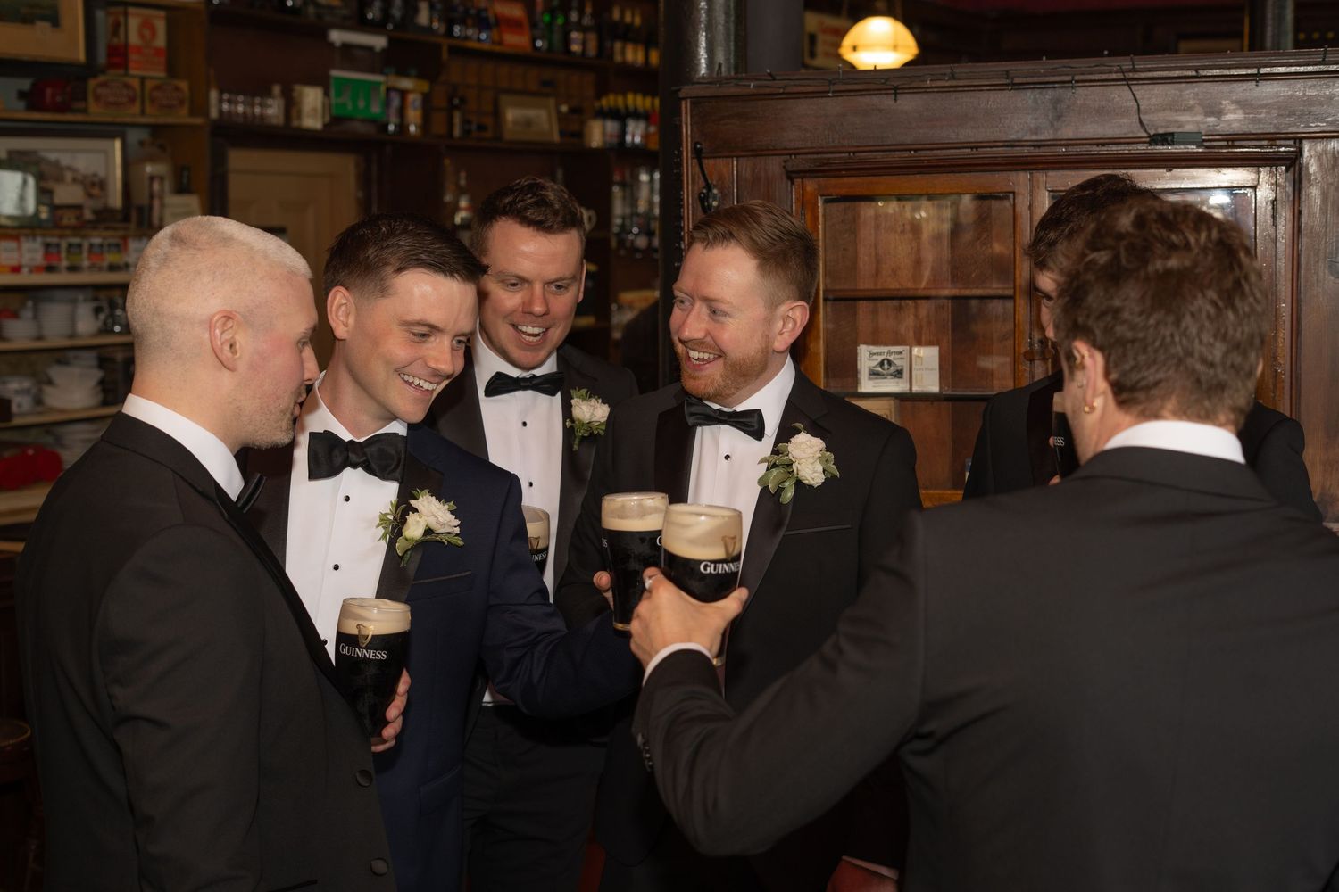 The groom and his groomsmen cheersing at a Brisbane wedding