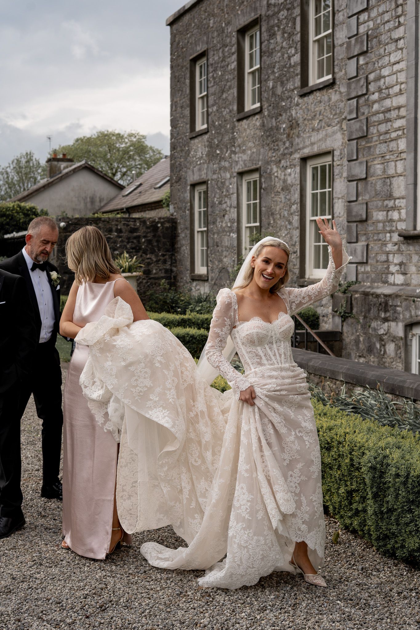 The bride waving to her friends at a Brisbane wedding