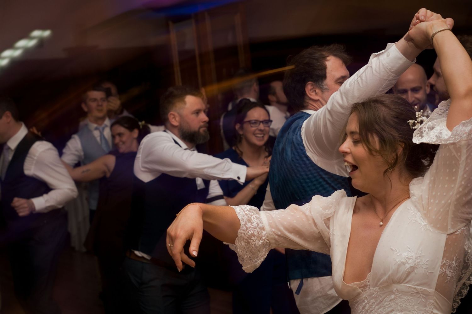 A bride being twirled on a dance floor at a Gold Coast wedding