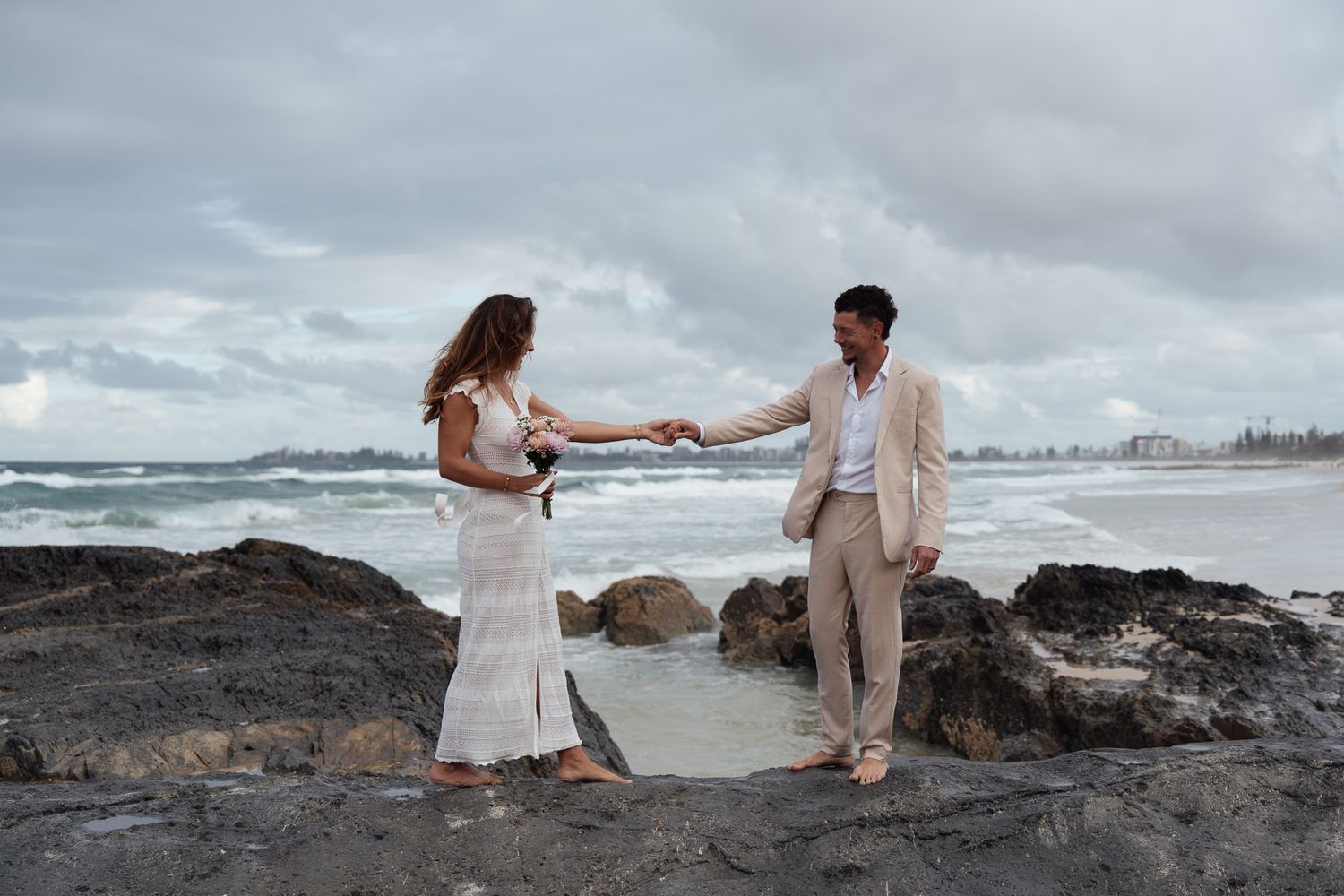 Man and women holding hands after getting eloped on the Gold Coast