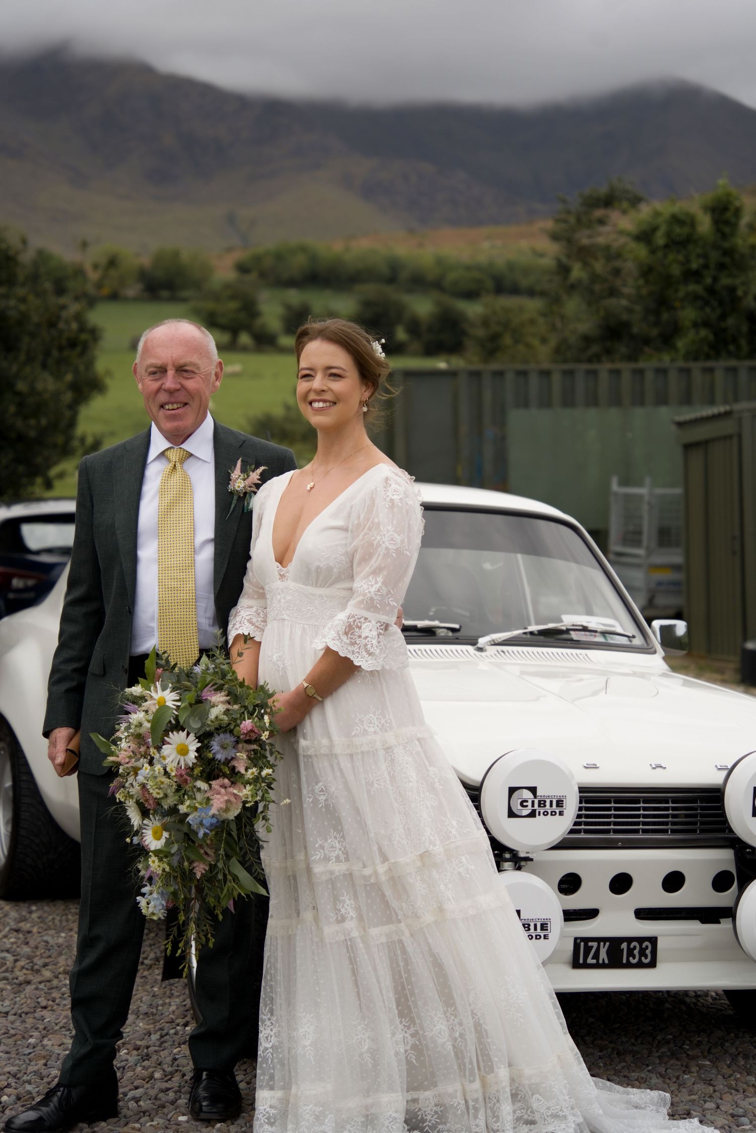 A bride with her father about to get into the car to the Scenic Rim wedding ceremony