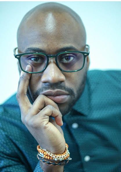 Emmanuel Elvis Asare Bediako
A series of five close-up photos showing someone wearing glasses and a gold bracelet against a blue background.
