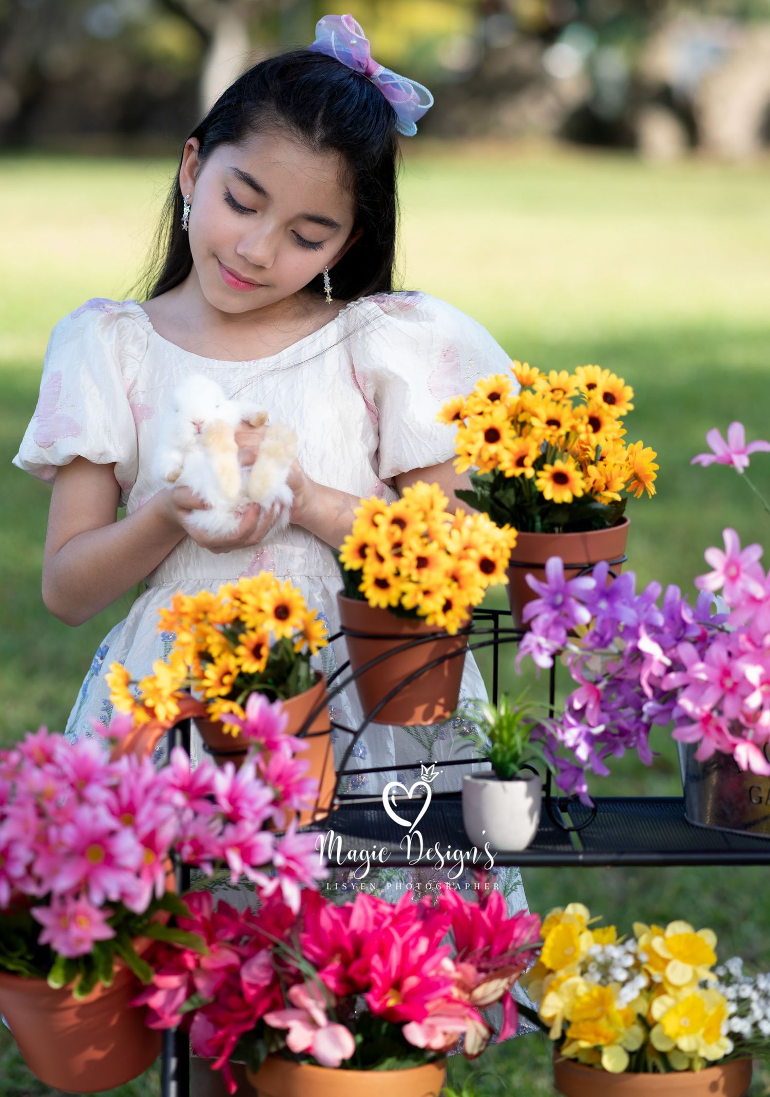 Garden scene with colorful sunflowers and pink flowers in terracotta pots.