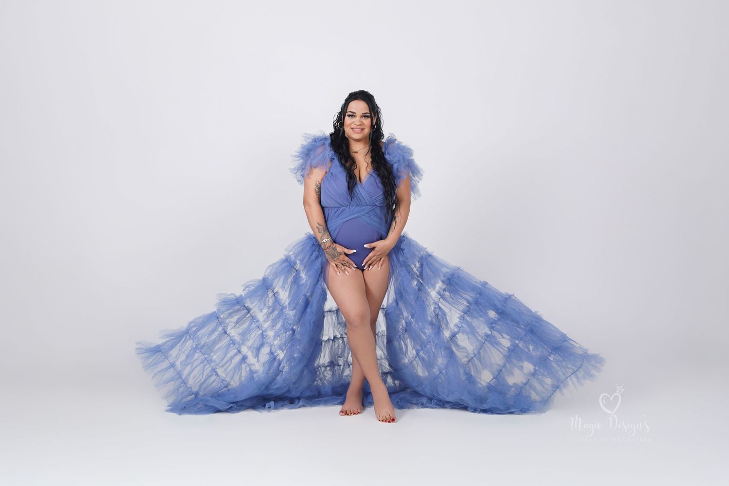 Studio portrait series featuring flowing periwinkle blue gown.