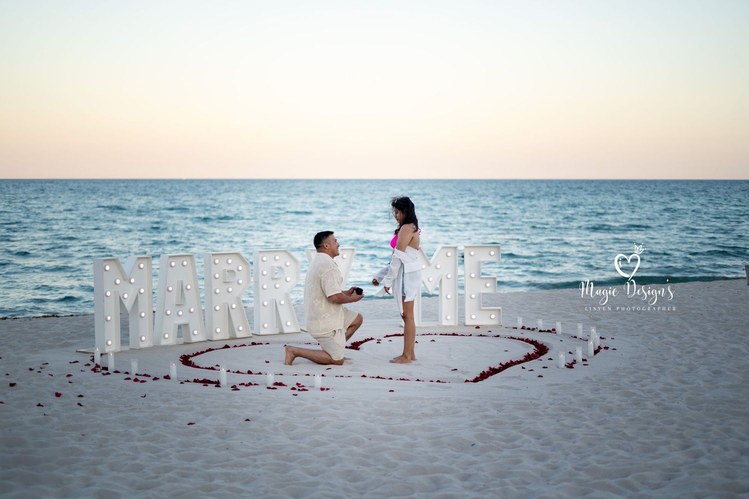 Message written in sand on a beautiful beach at sunset creating a romantic seaside scene.