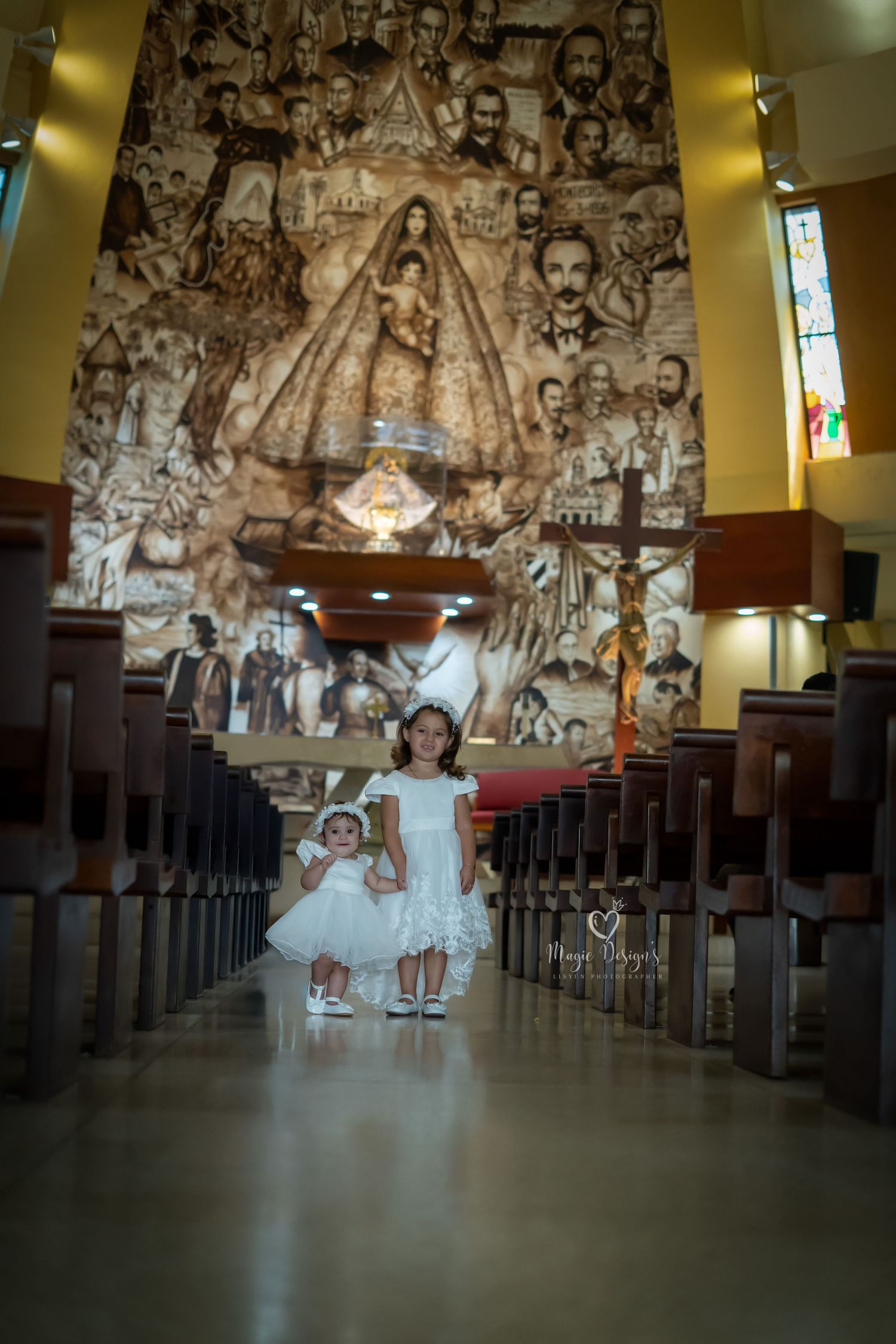Church interior with ornate wall murals and wooden pews.