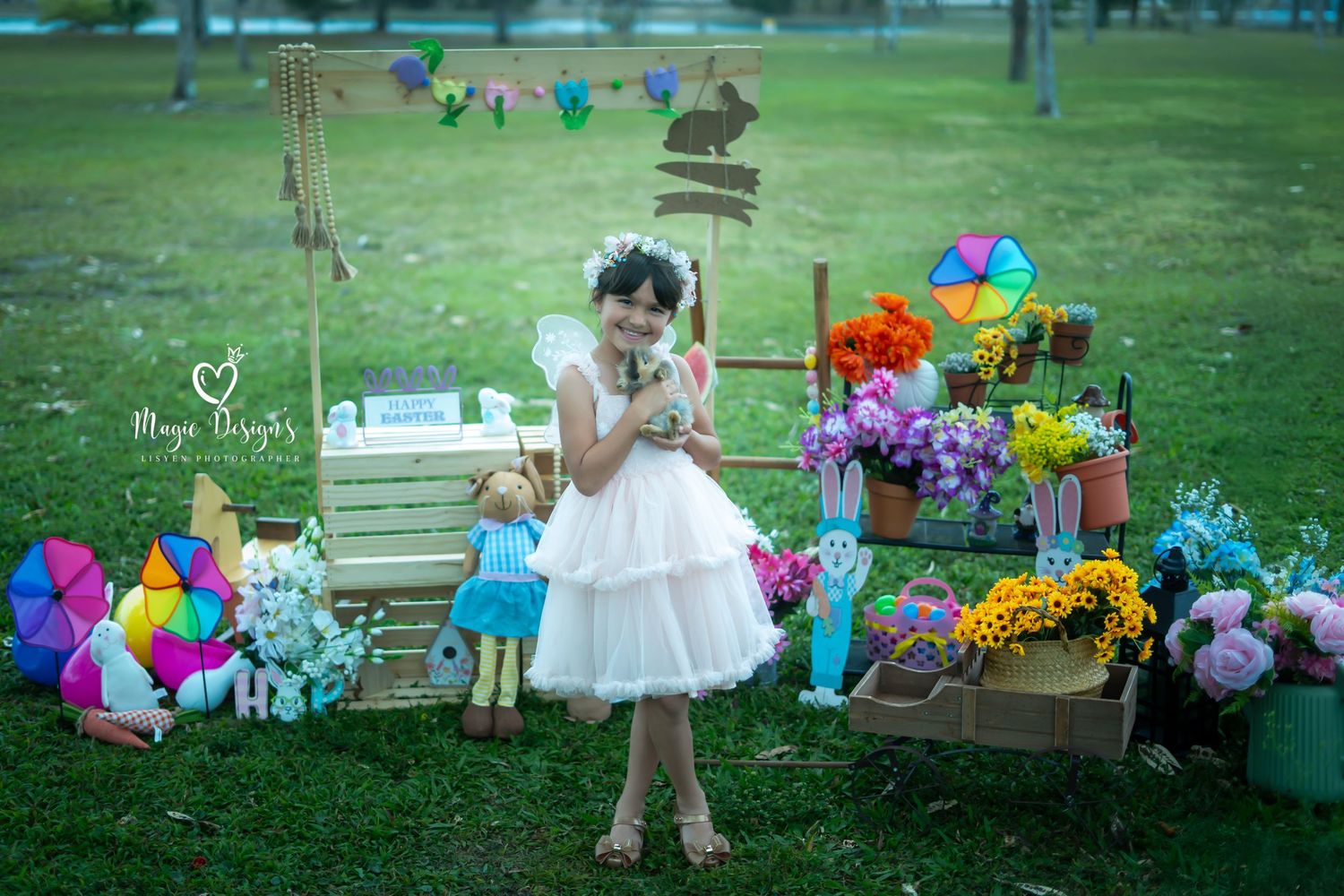 Colorful outdoor party setup with balloons and decorations in a garden setting.