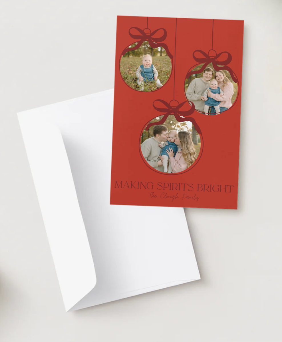 Red holiday card with three ornament-shaped photo frames and Making Spirits Bright text, paired with a white envelope.