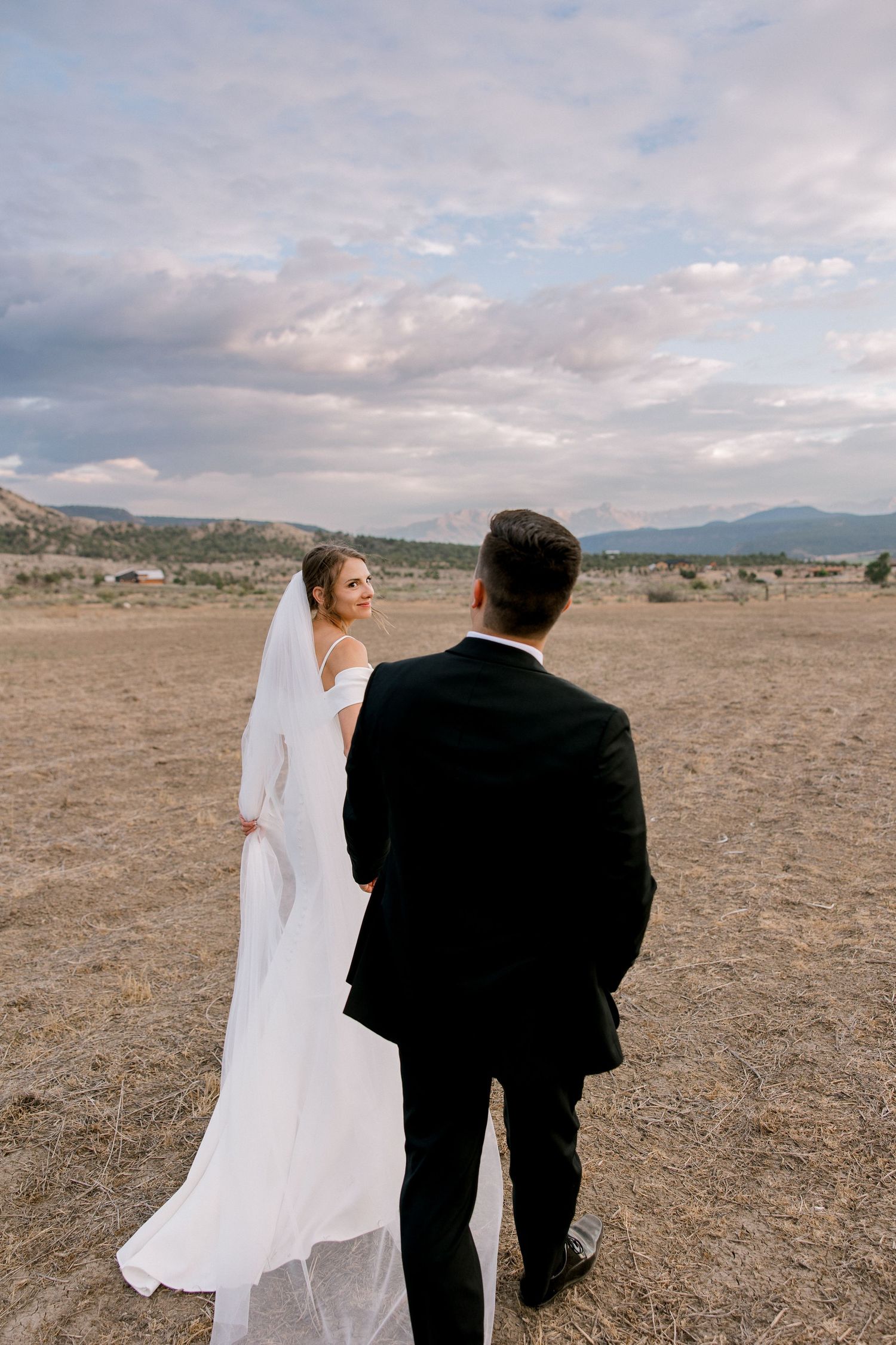 Bride looking back at groom at sunset in Cookeville, TN - Olivia Merritt Photography