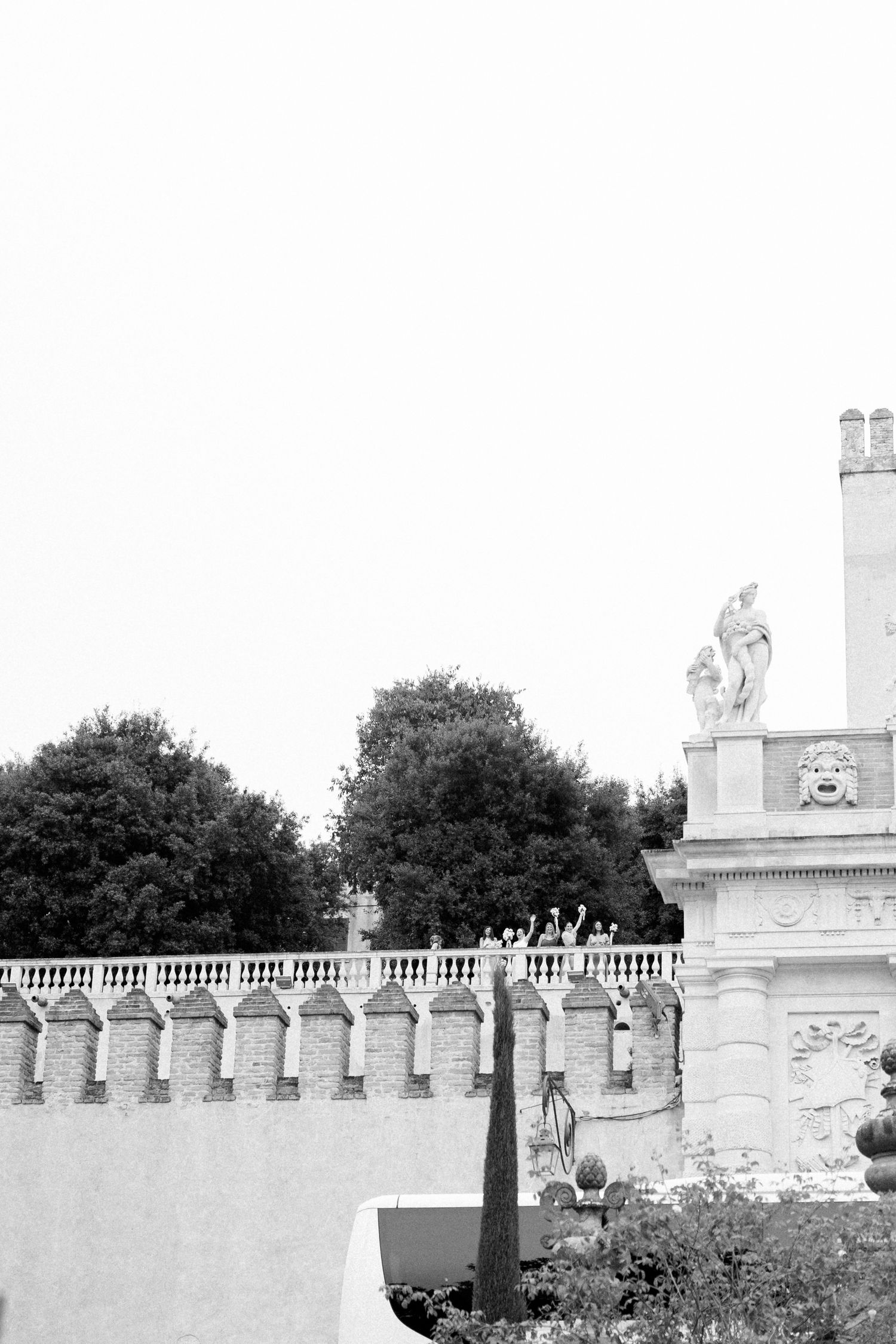 Black and white architectural detail of historic balustrade and statues.