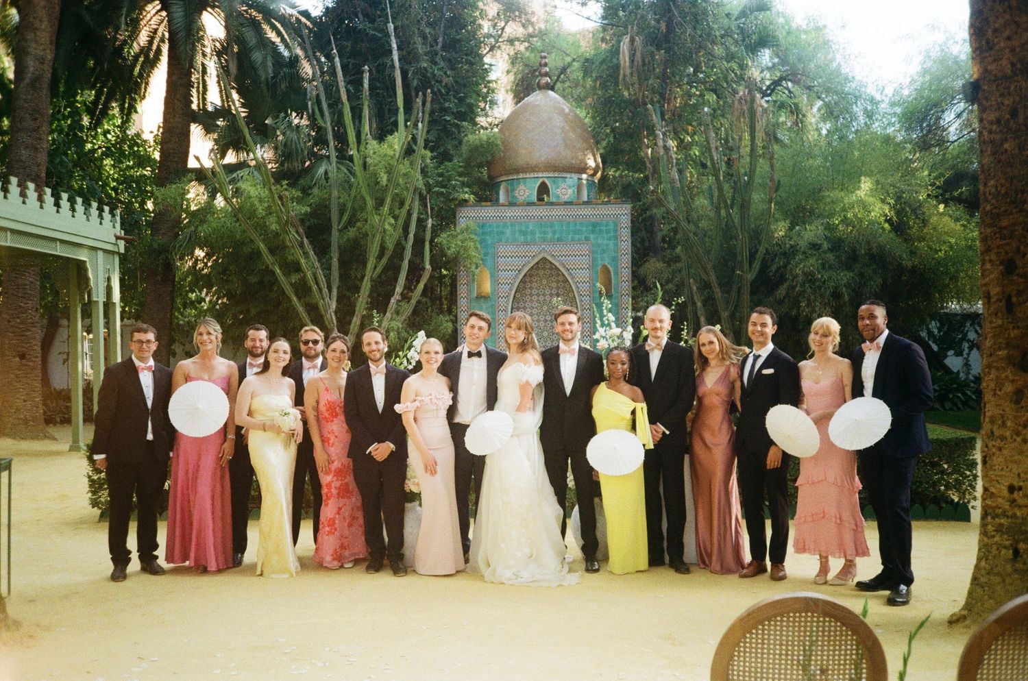 A panoramic collage of wedding party photos taken outdoors with bridesmaids and groomsmen lined up in formal attire.