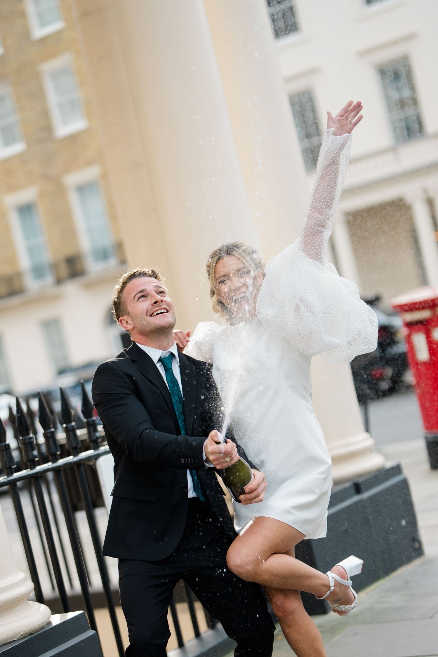 Joyful celebration captured in a series of candid moments on a London street.