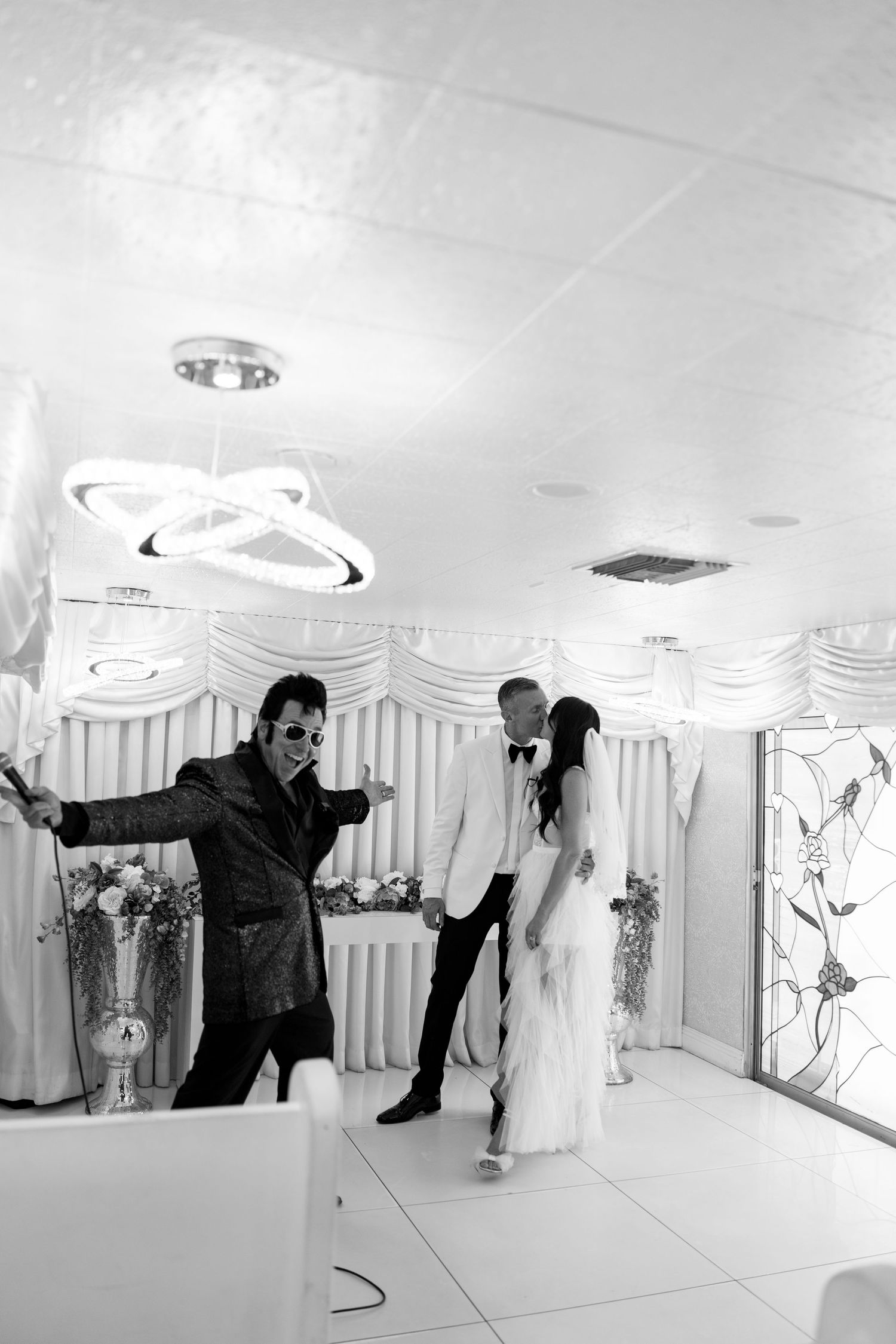 Celebratory wedding moment with an entertainer performing during the ceremony.