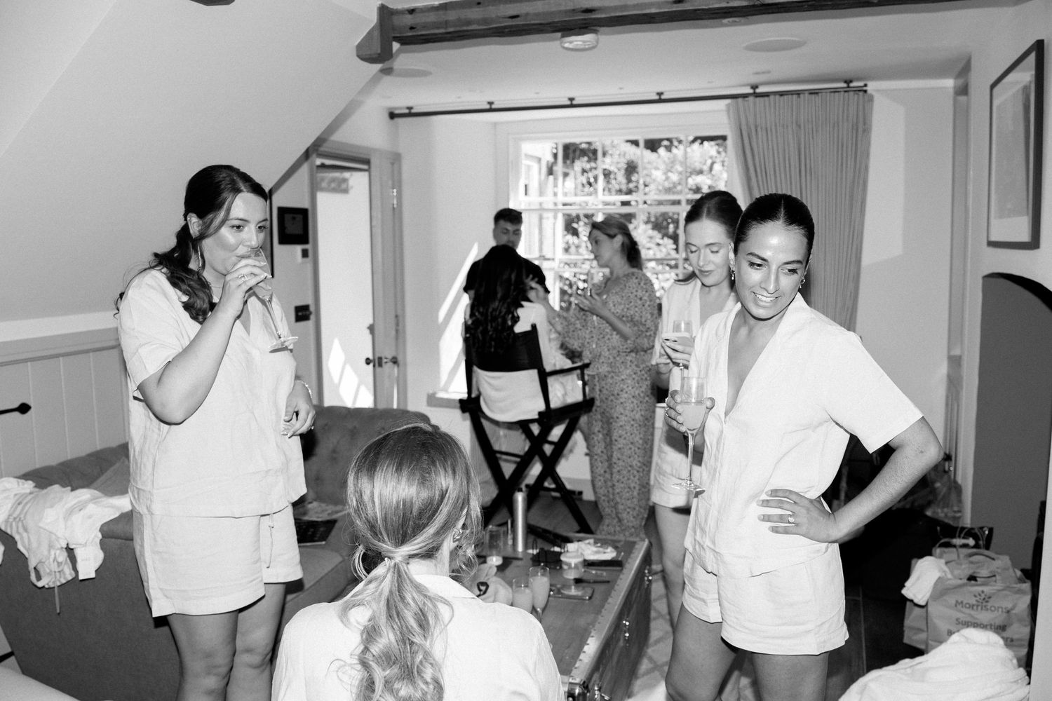 Black and white candid shots of wedding preparation moments.