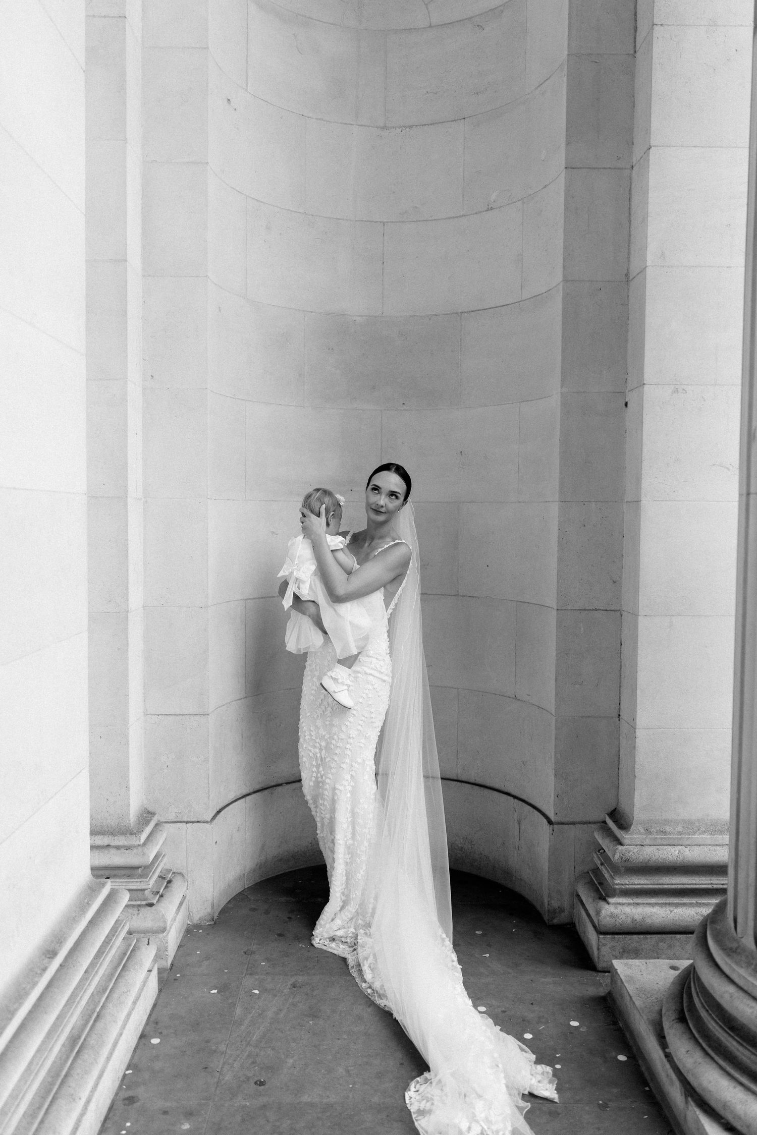 Artistic series of bridal portraits against white classical columns.