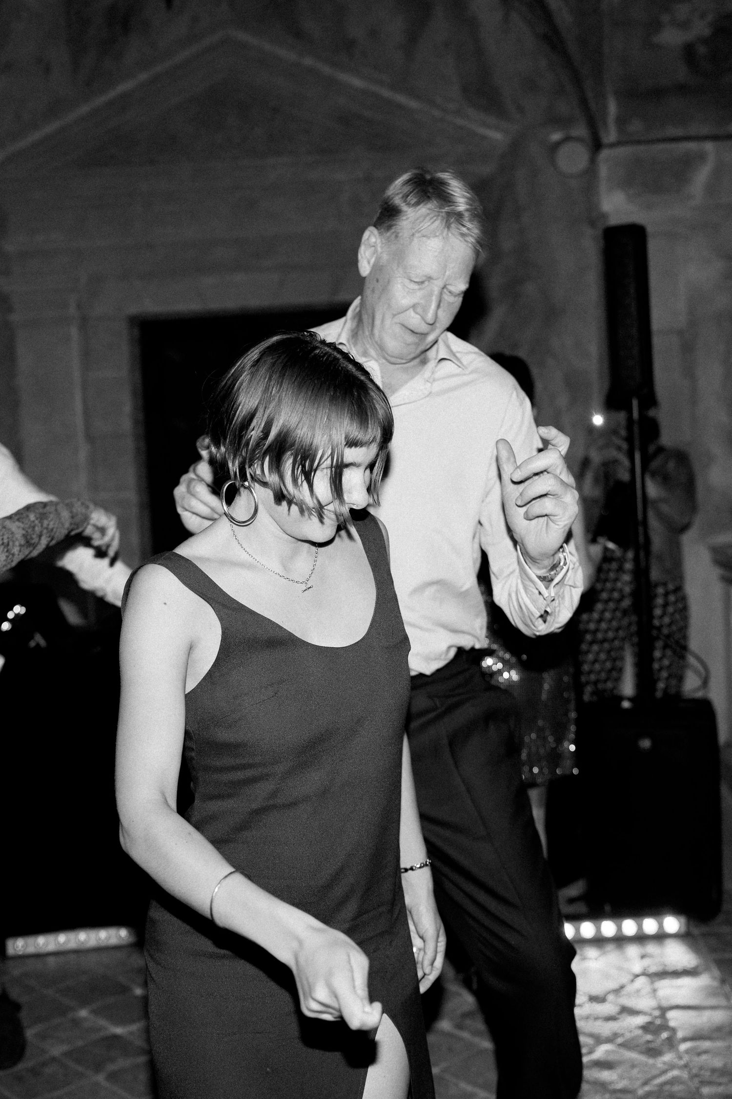 Black and white photos of people dancing and having fun at a party.