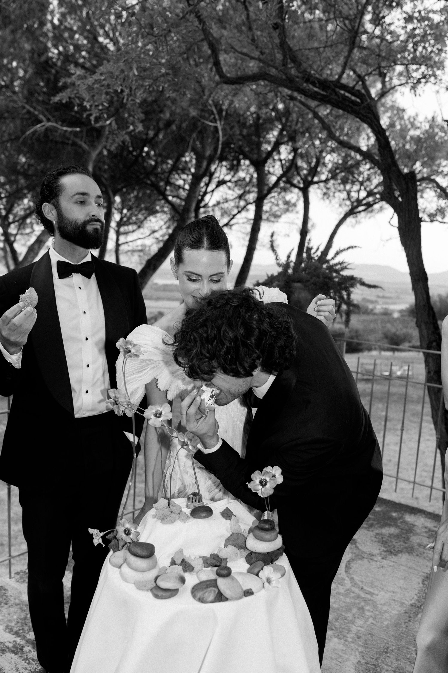 Black and white photo series of wedding party members sharing drinks and laughter outdoors.