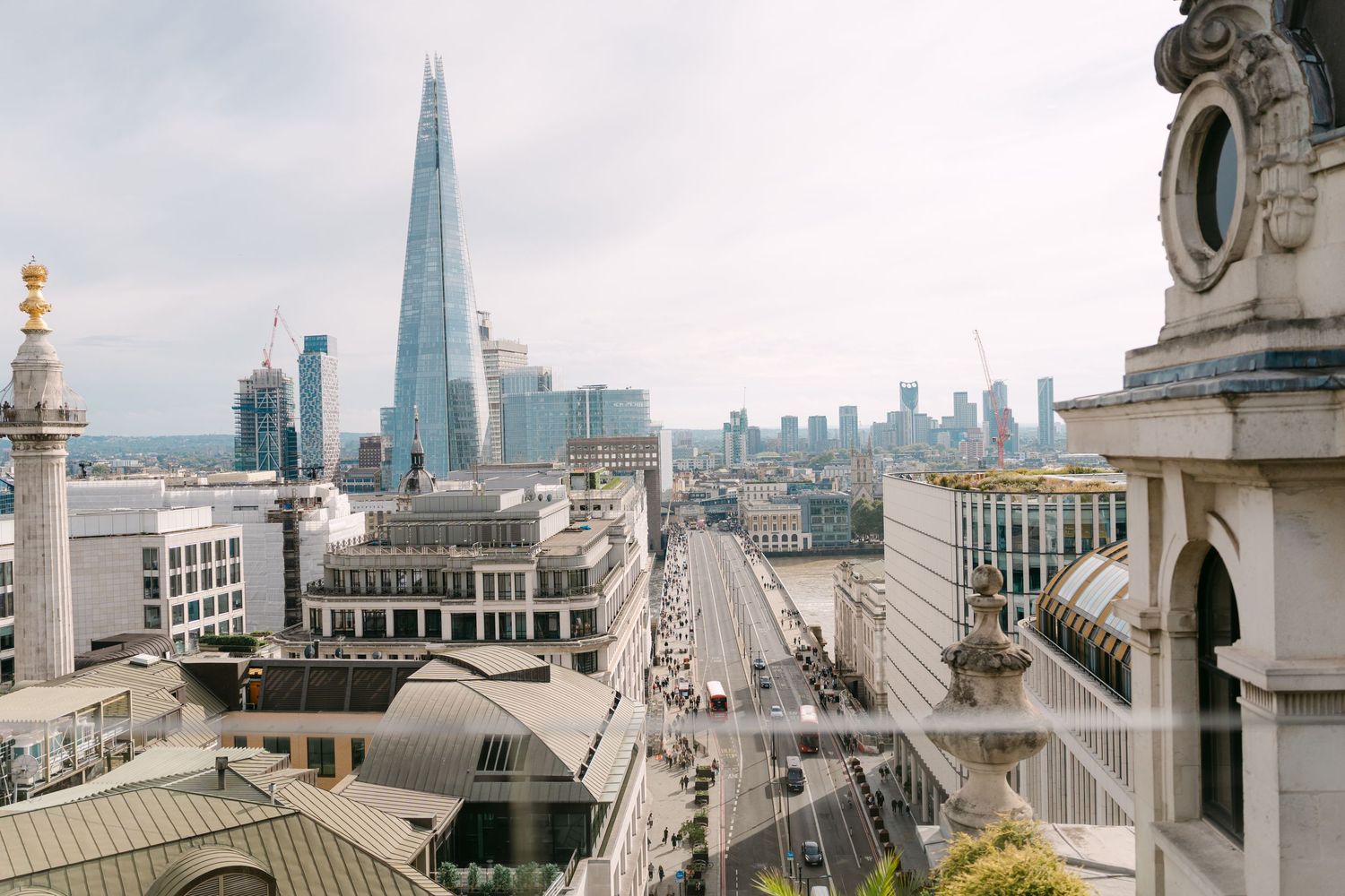 Aerial view of London streets with The Shard dominating the skyline.