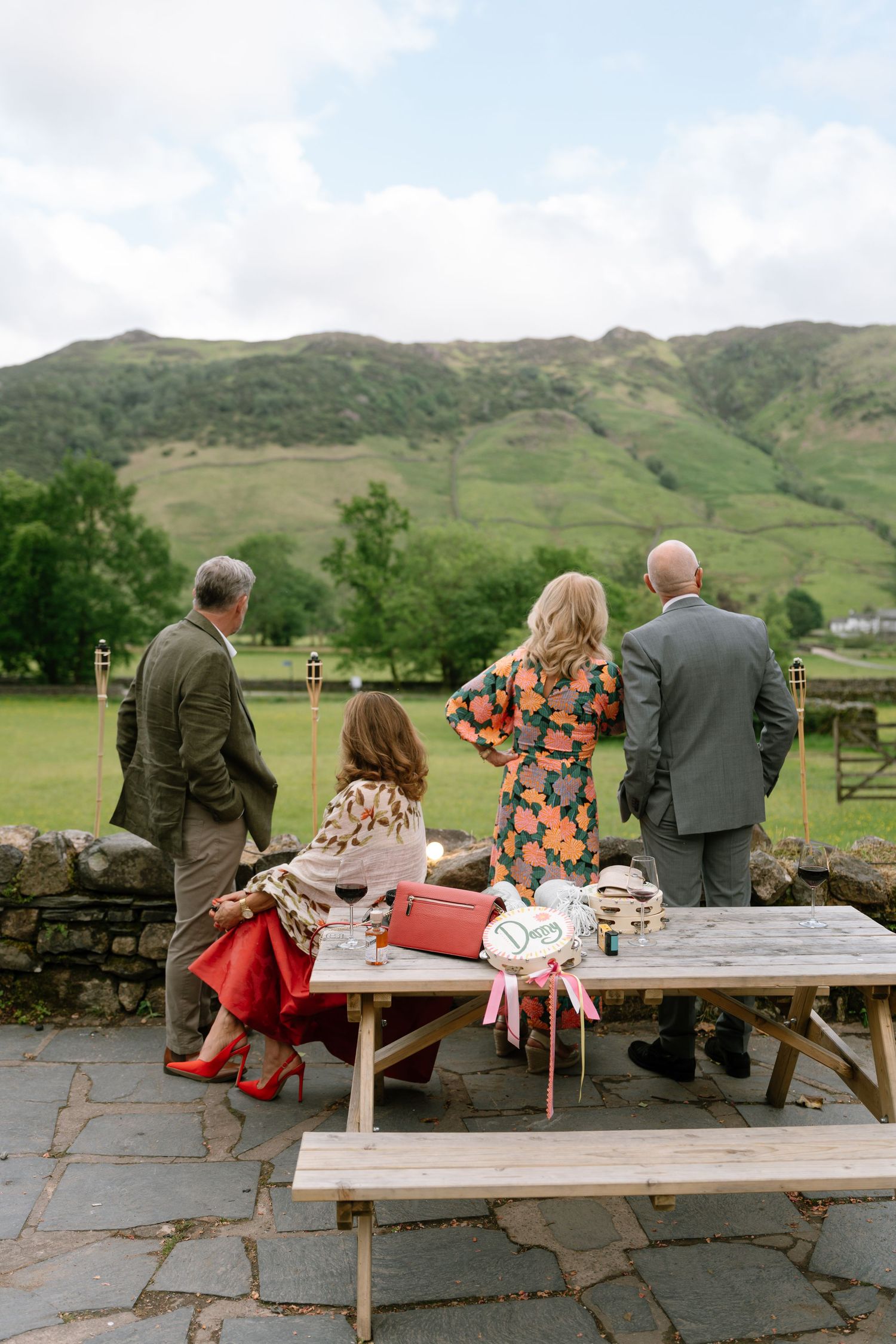 Group enjoying outdoor picnic with scenic mountain views in the Lake District.