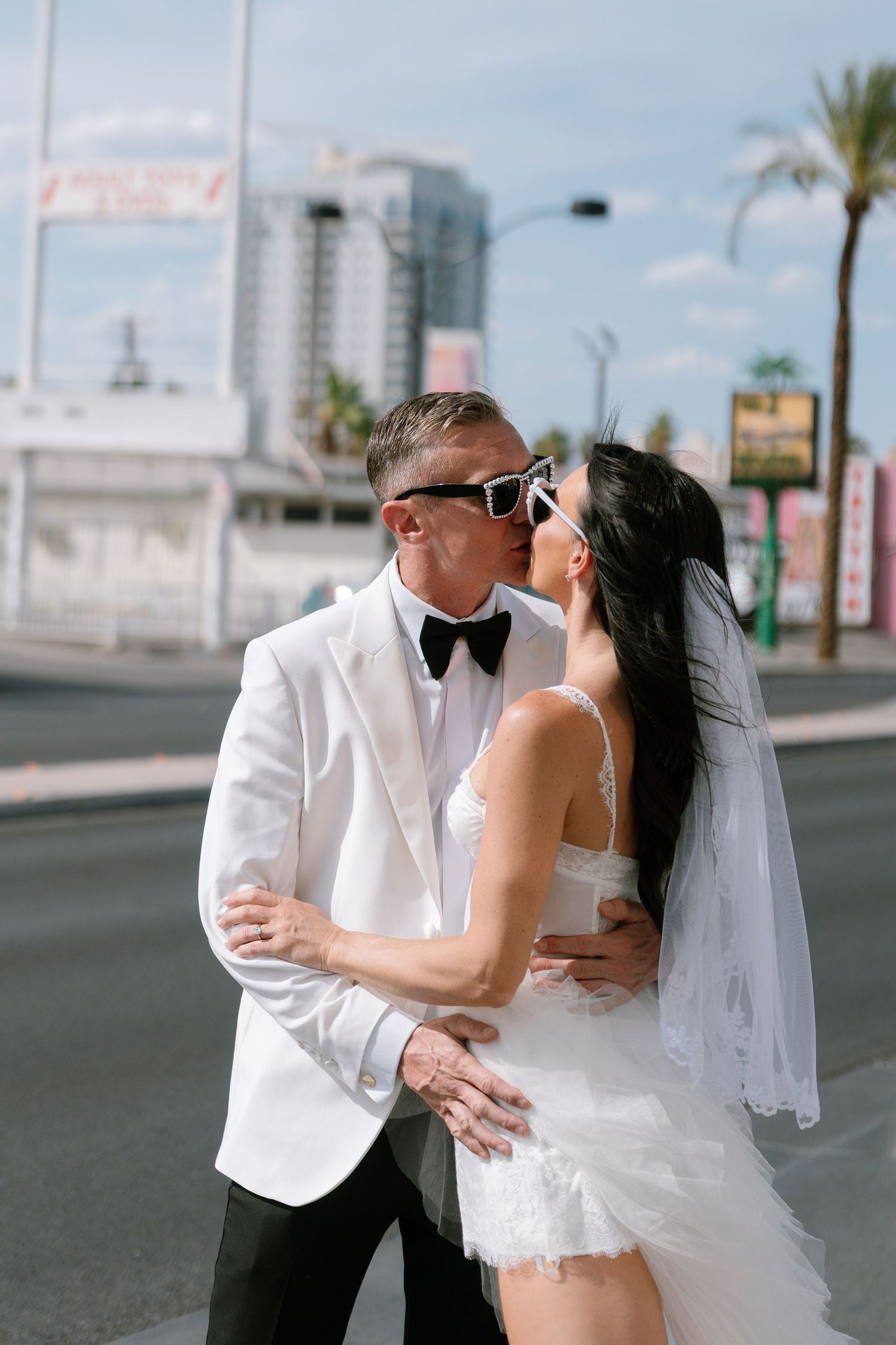 Romantic wedding portraits captured on a sunny Las Vegas street.