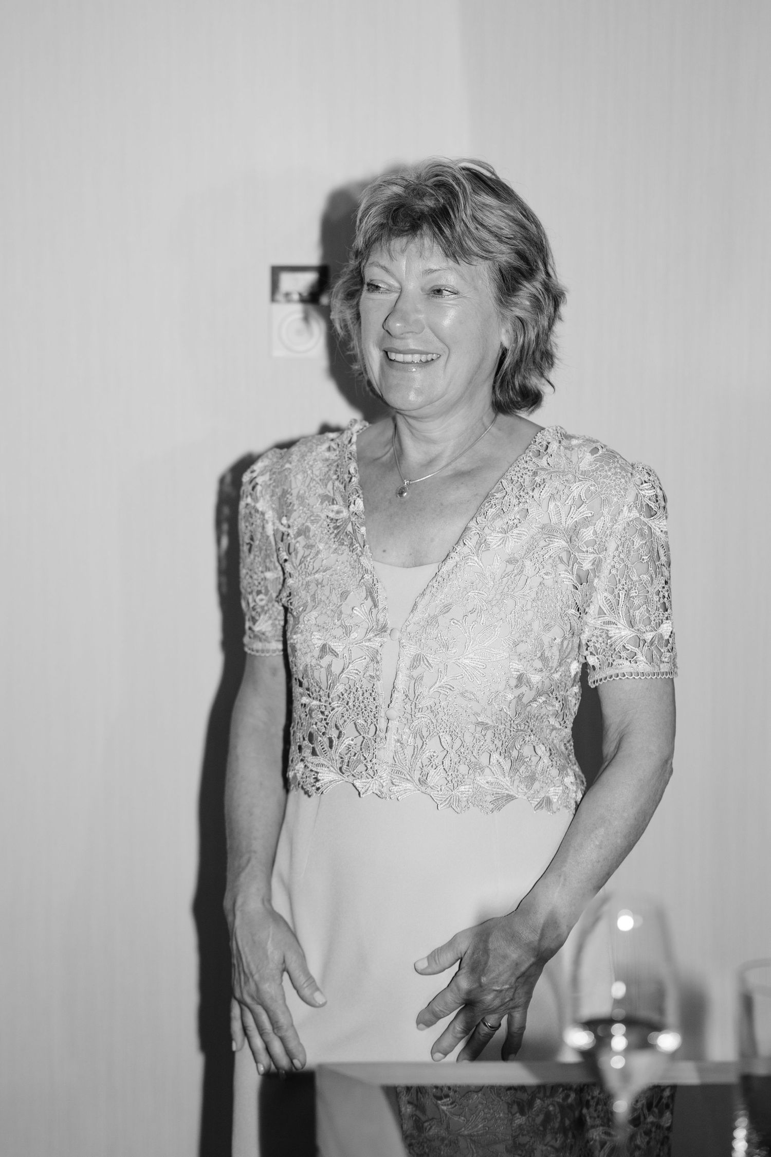 Joyful celebration moments captured in black and white during wedding preparations.
