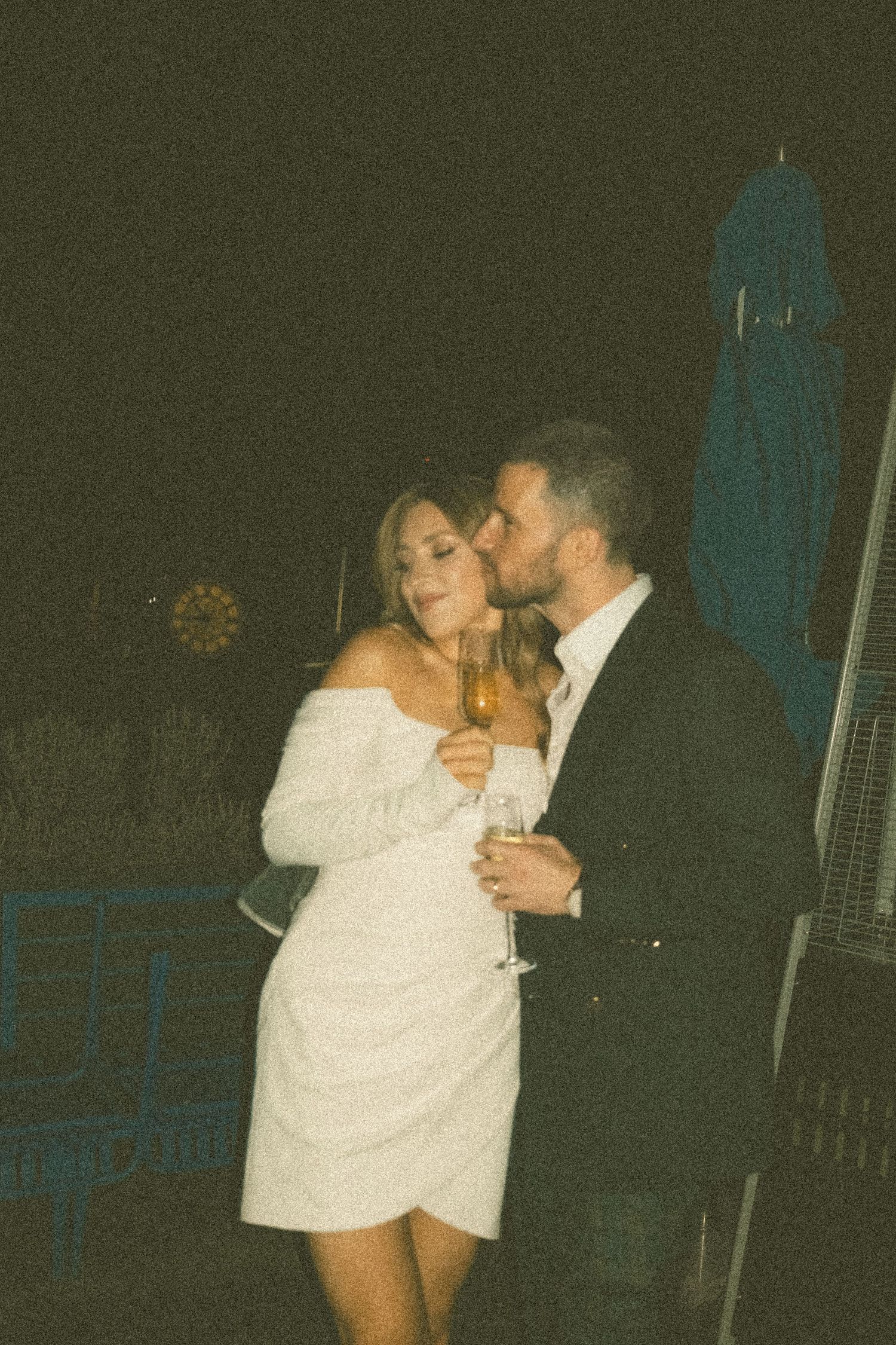 Intimate dance sequence captured in vintage-style photography with warm lighting.