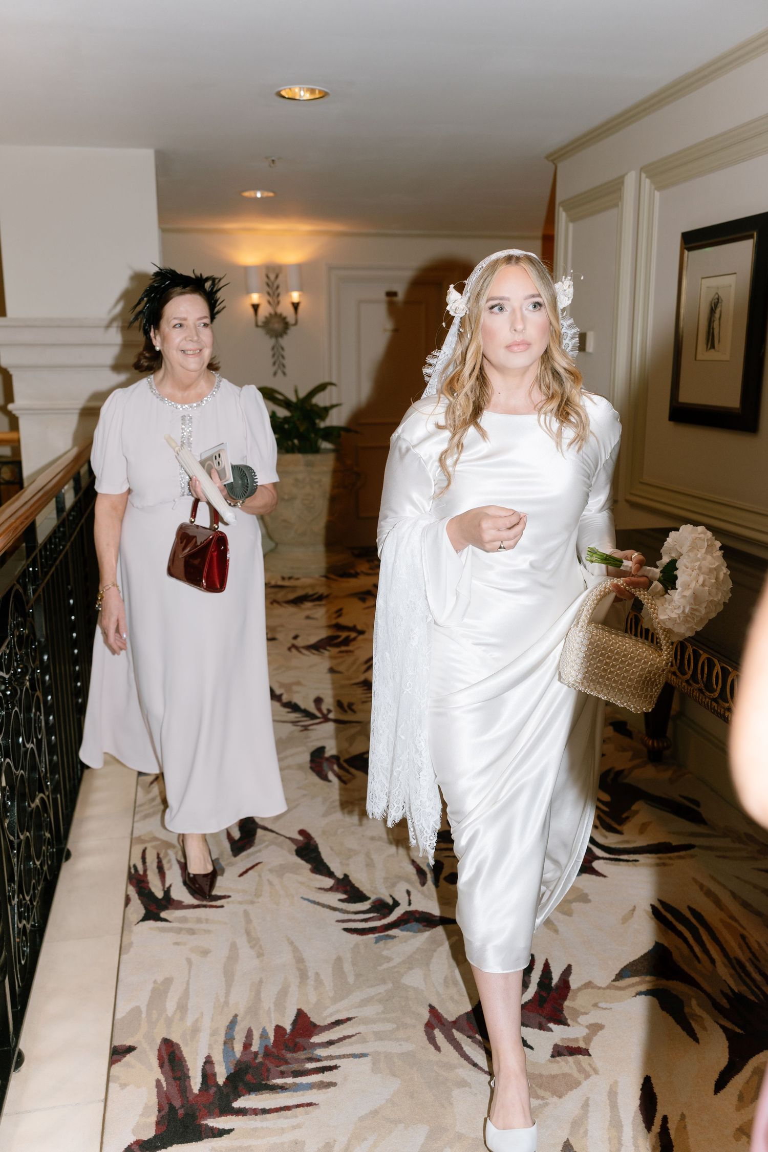 Sequence of photos showing people in white dresses walking across a luxurious marble floor.