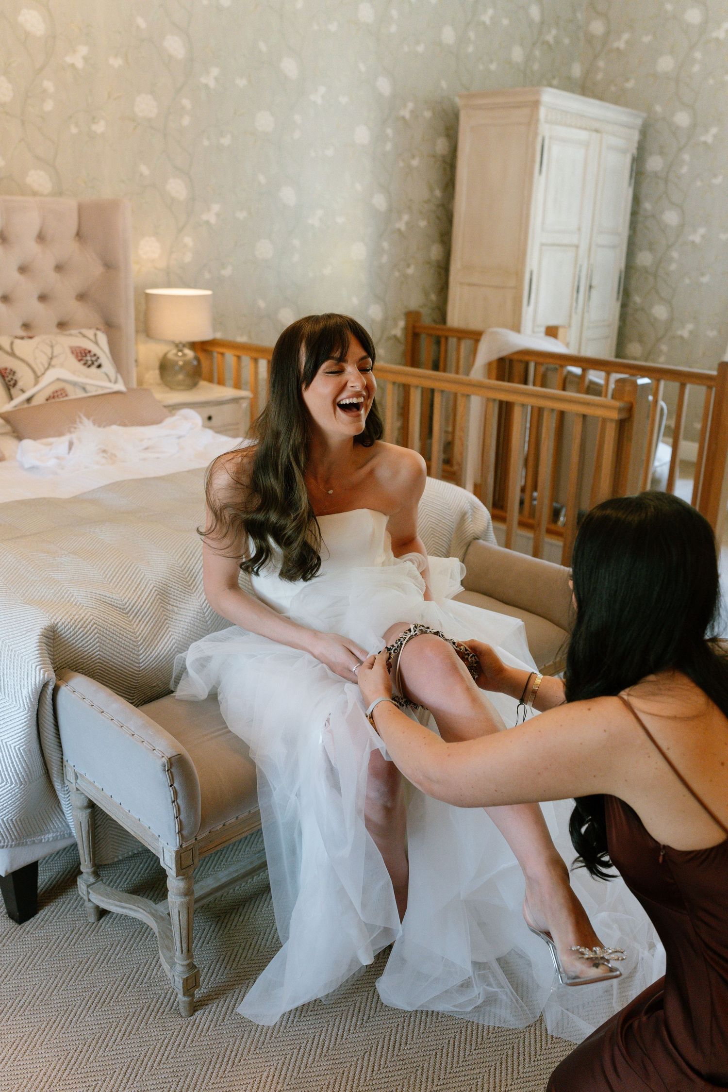 Sequence showing playful poses on vintage furniture in a room with floral wallpaper.
