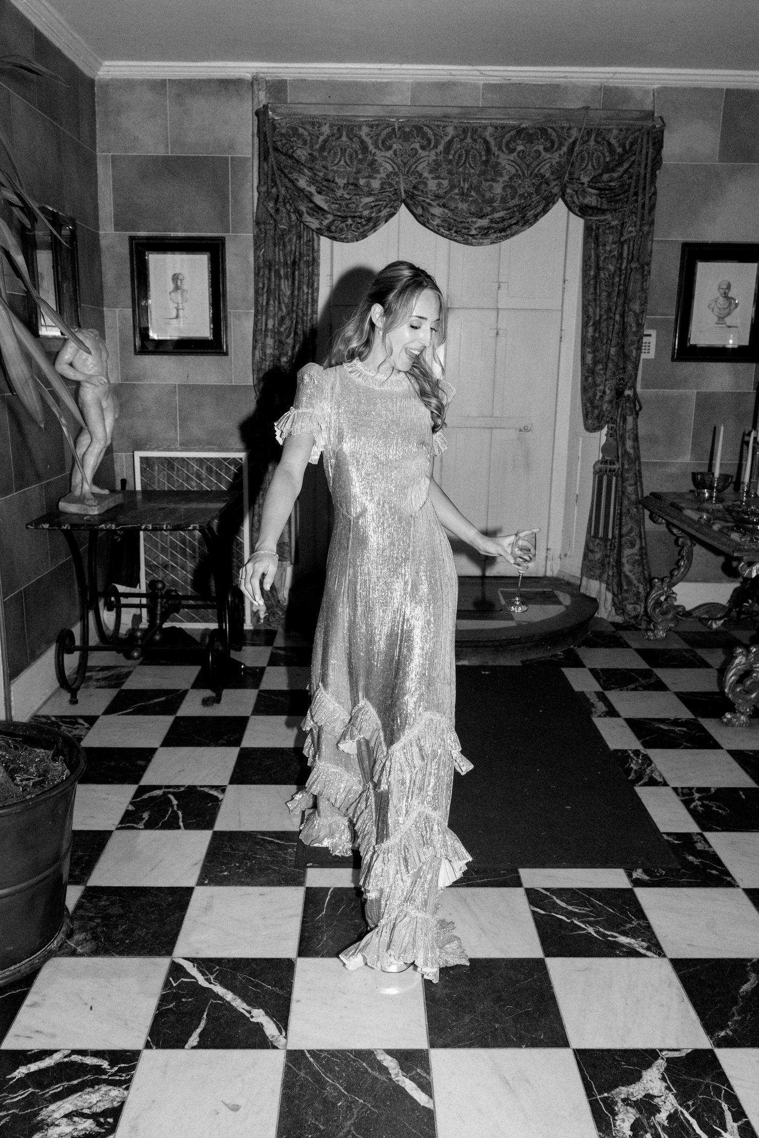 A series of dance movements captured in black and white on a geometric patterned floor.