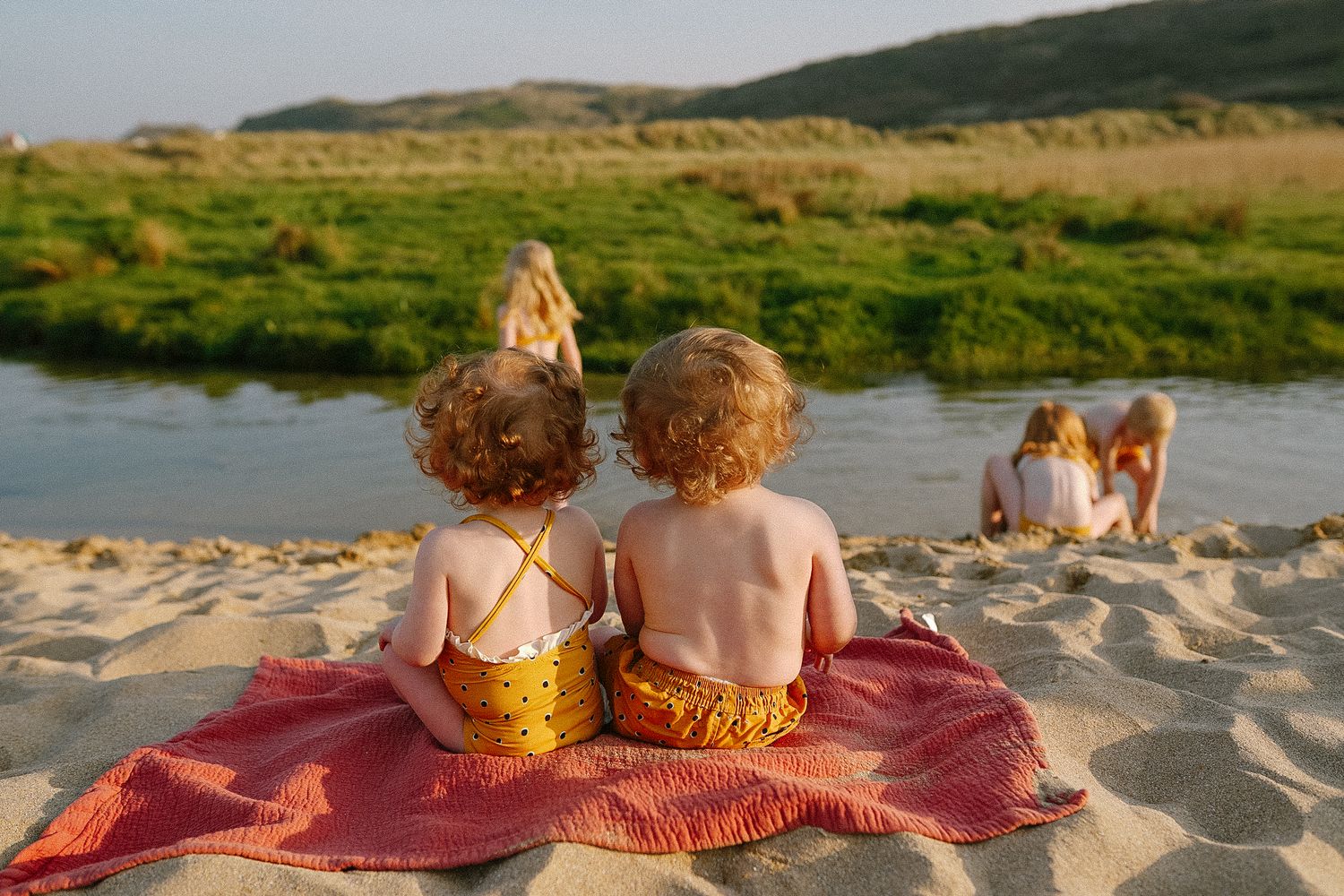 Series of sunset beach photos showing playful moments at the shoreline.