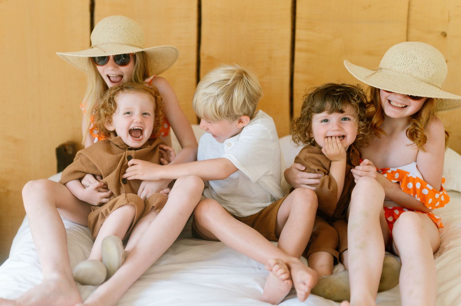 Group wearing sun hats lounging indoors on a warm sunny day.