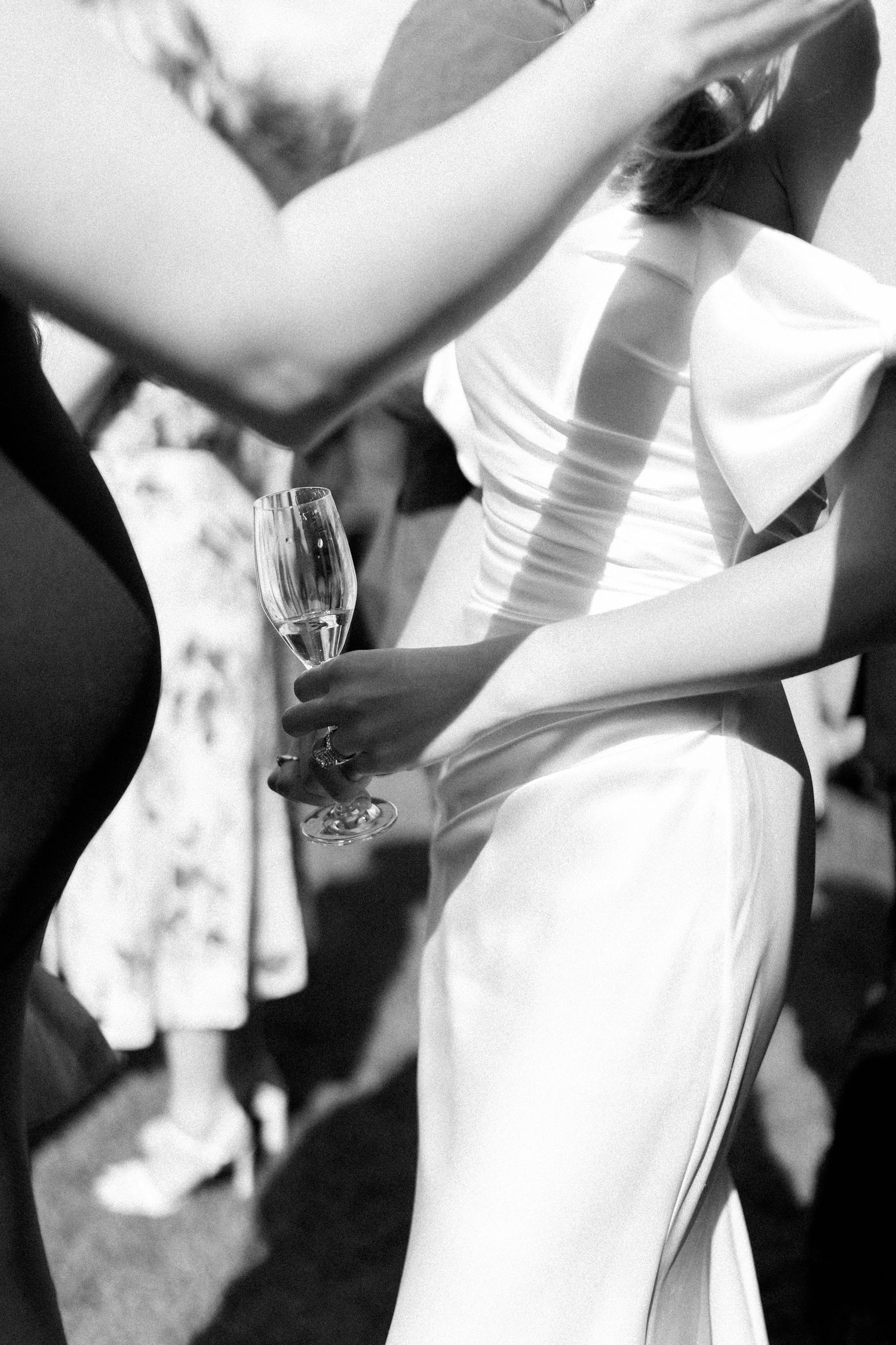 Black and white artistic shots of wedding dress details.