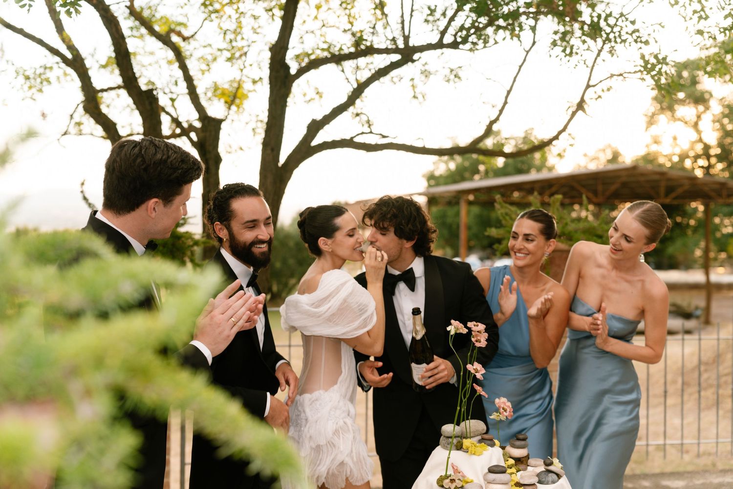 Candid outdoor celebration moments captured in a series of joyful interactions.