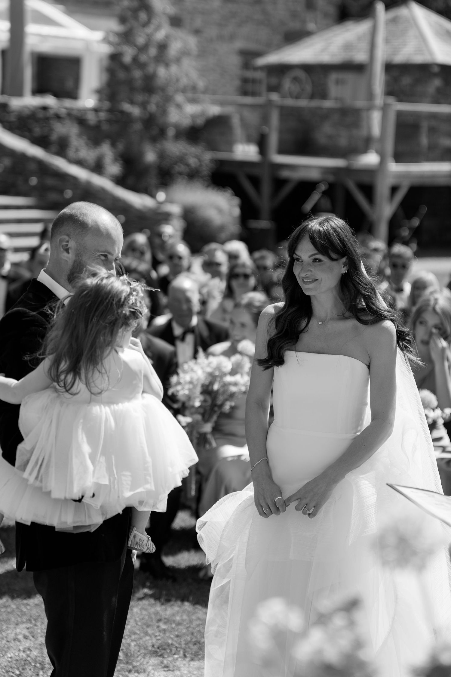 Black and white photos capture intimate moments during outdoor wedding celebration.