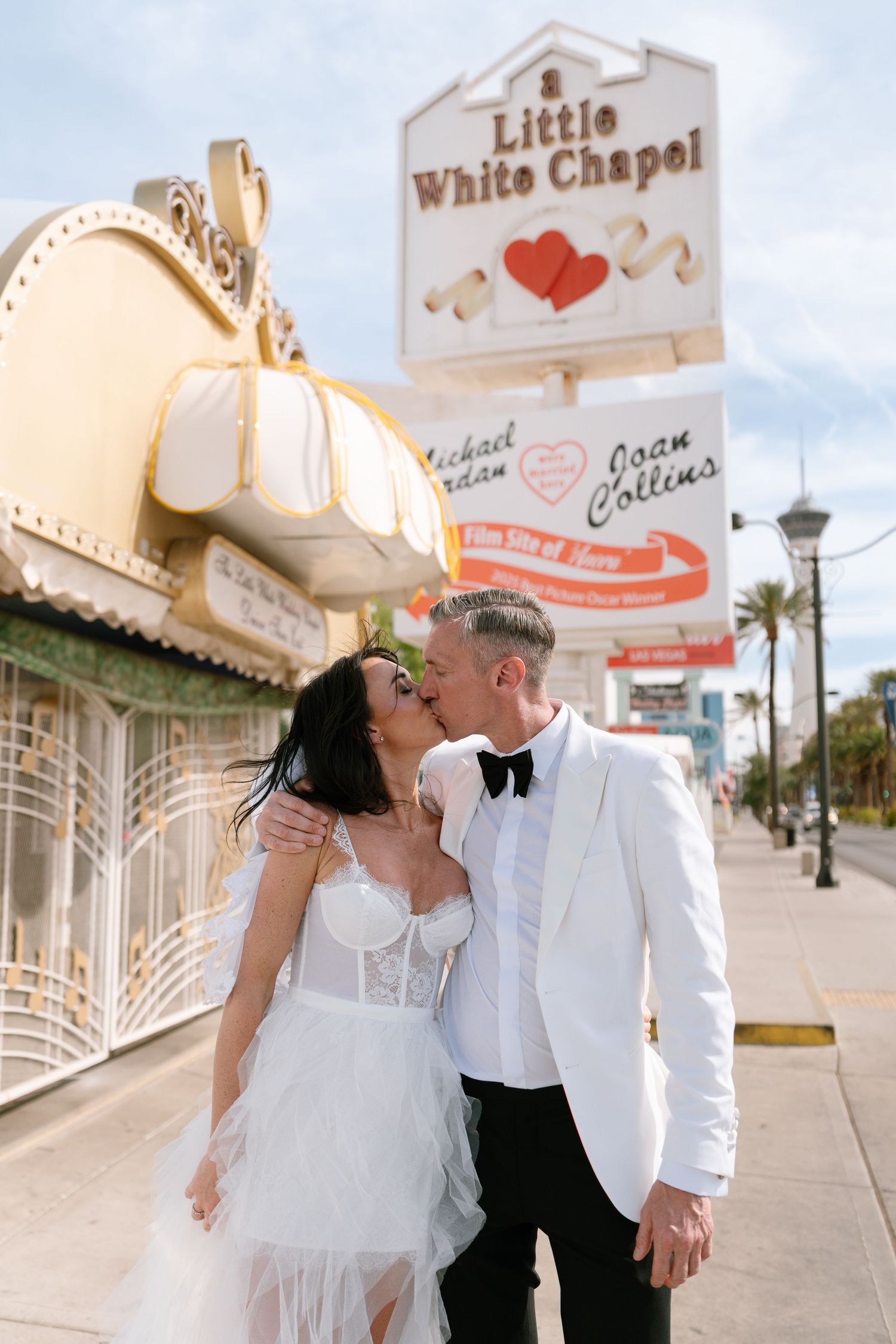 Romantic couple shares tender moments outside Little White Chapel in Las Vegas.