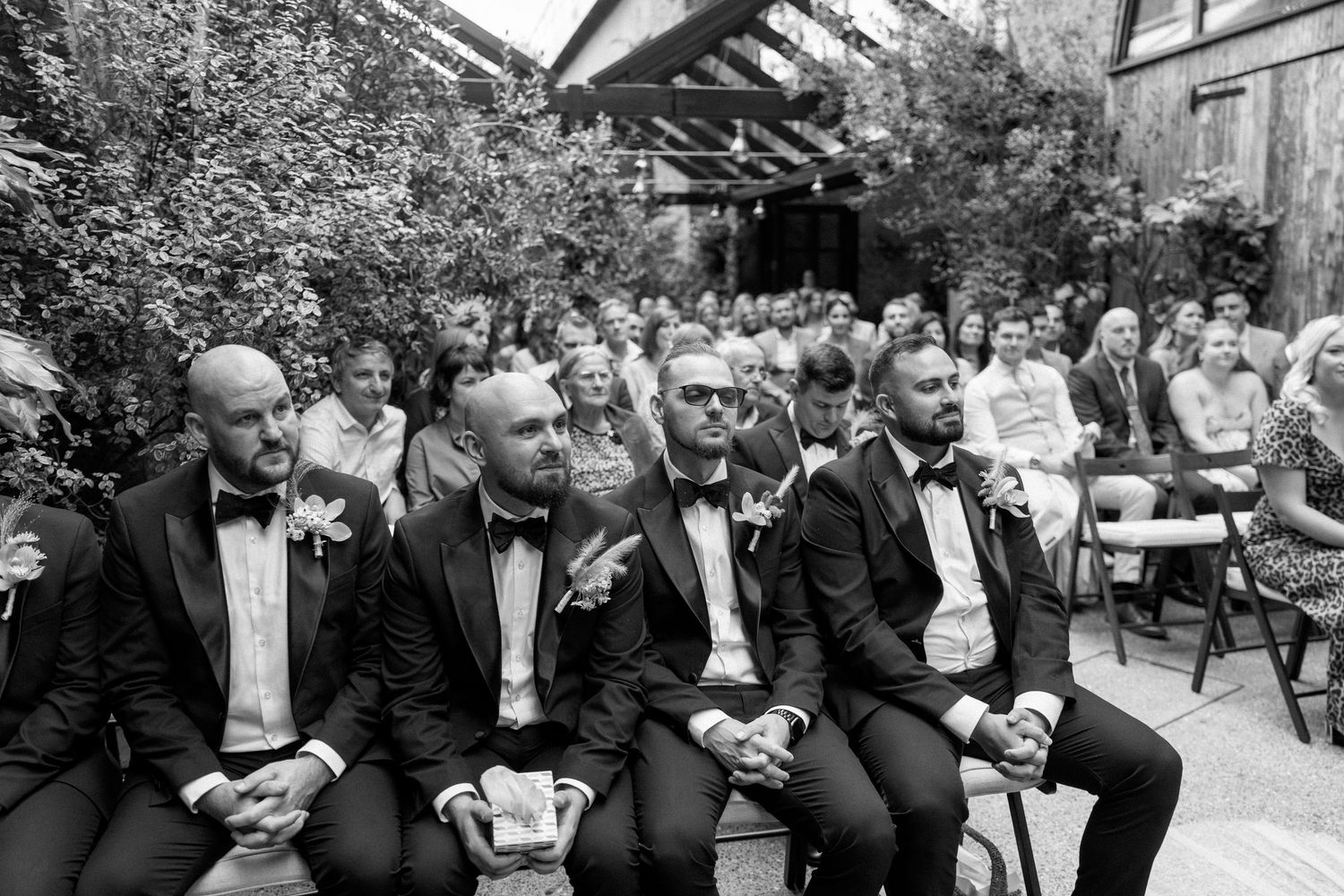 Black and white photos of wedding guests reacting emotionally during ceremony.