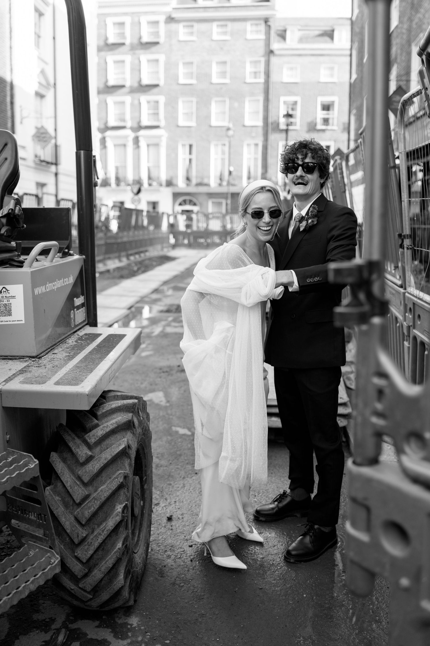Black and white photos of a couple in formal wear standing near industrial equipment.