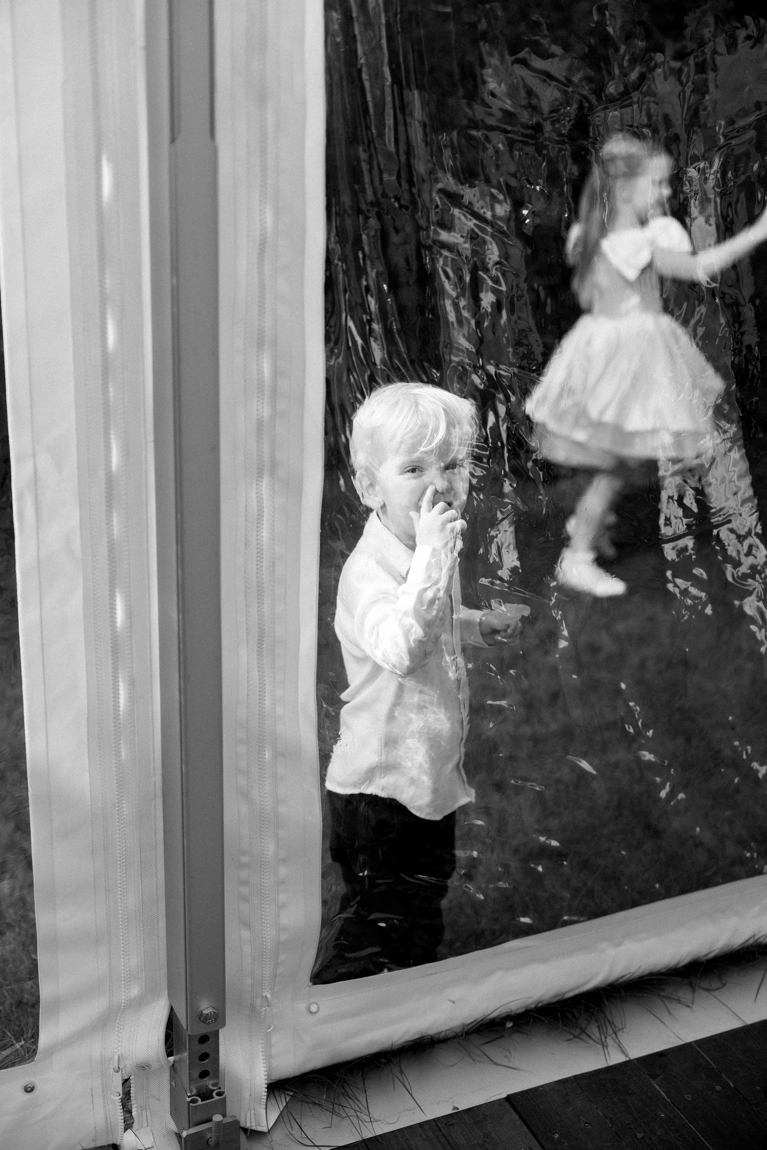 Black and white sequence showing playful dance movements in a creative photo series.