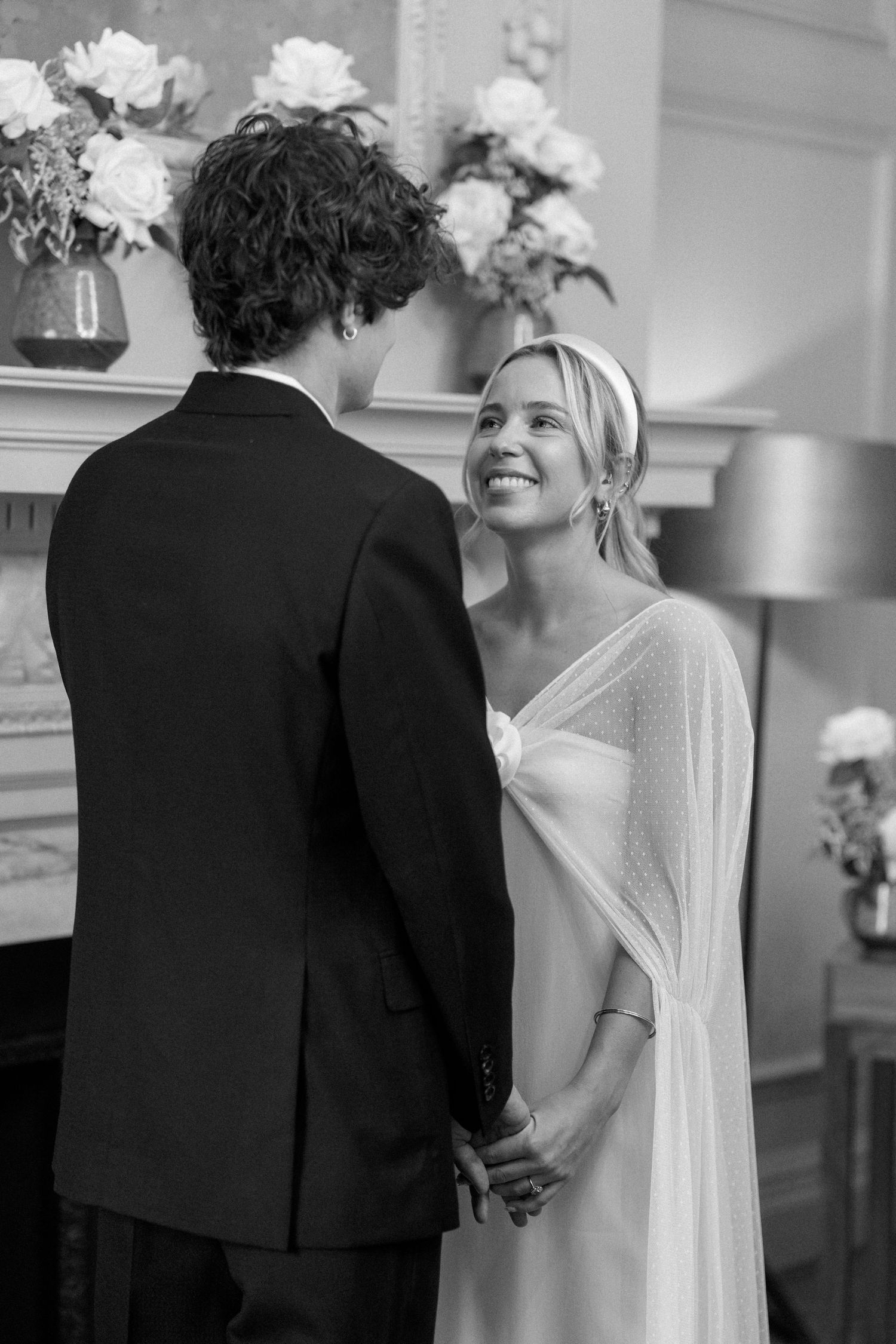 Candid wedding moment showing couple sharing laughter during their ceremony.