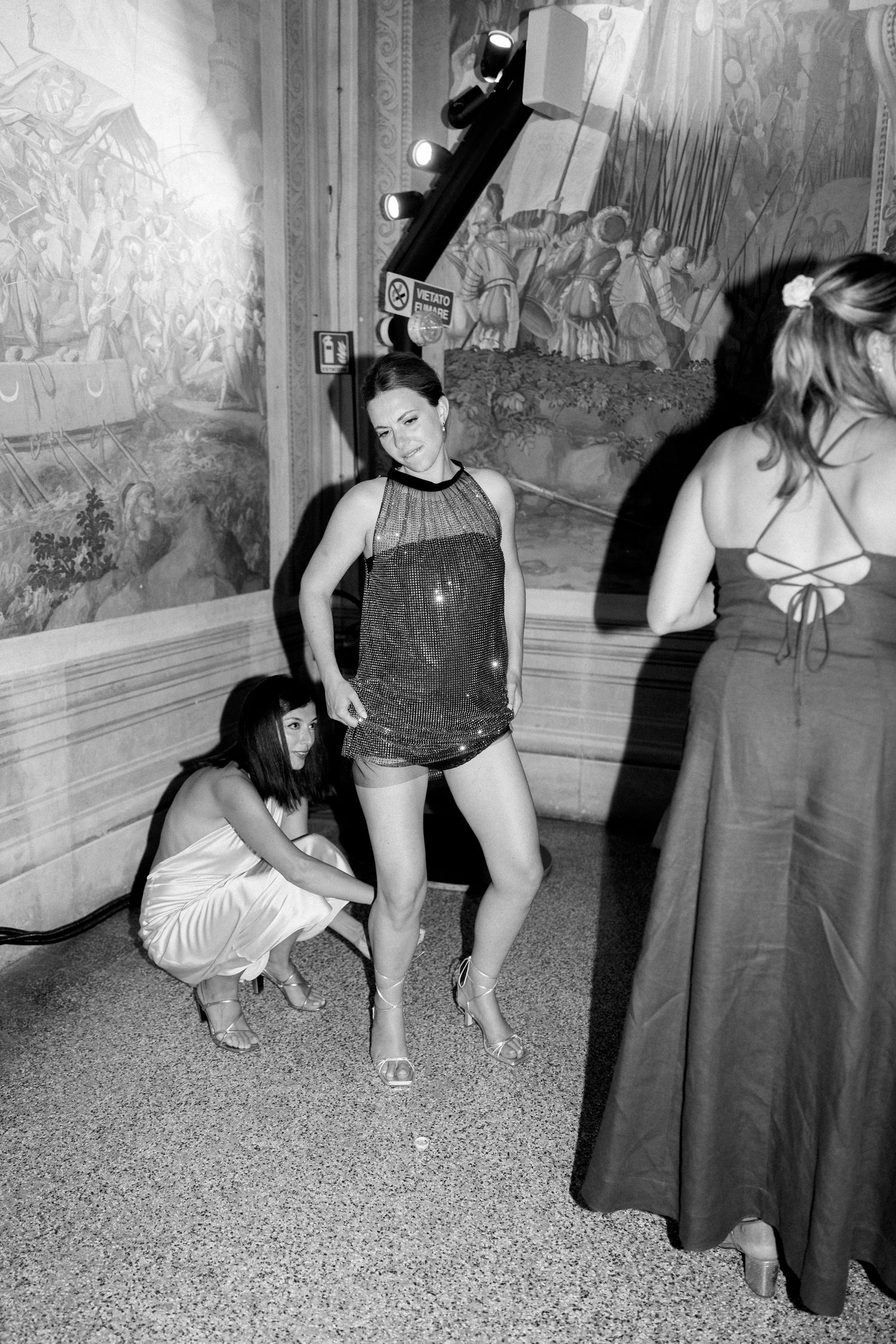 Dancing couples enjoying themselves at a formal evening event in black and white.