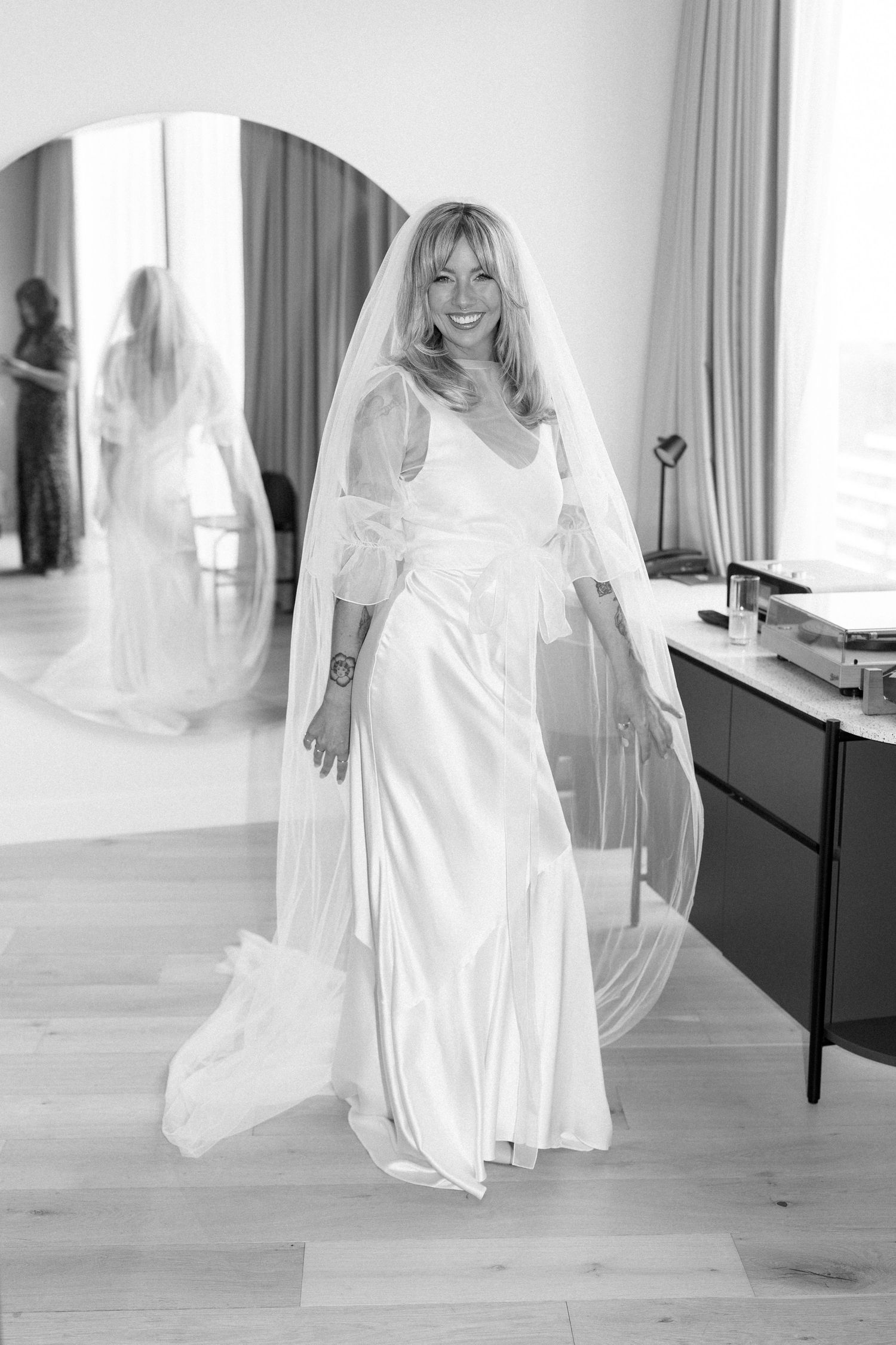 Series of photos showing a bride twirling in a flowing white wedding dress.