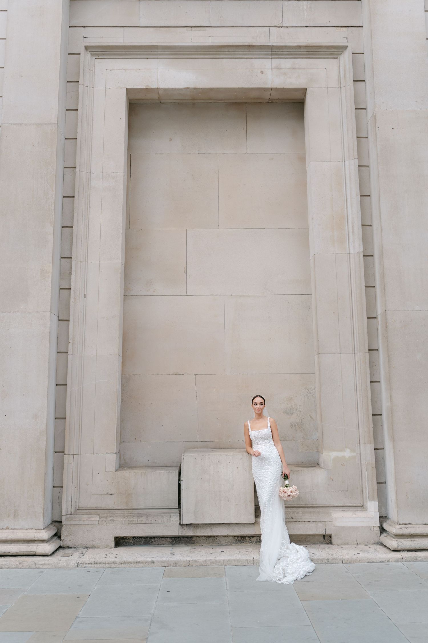 Wedding photo sequence showing a couple playing peek-a-boo between architectural columns.