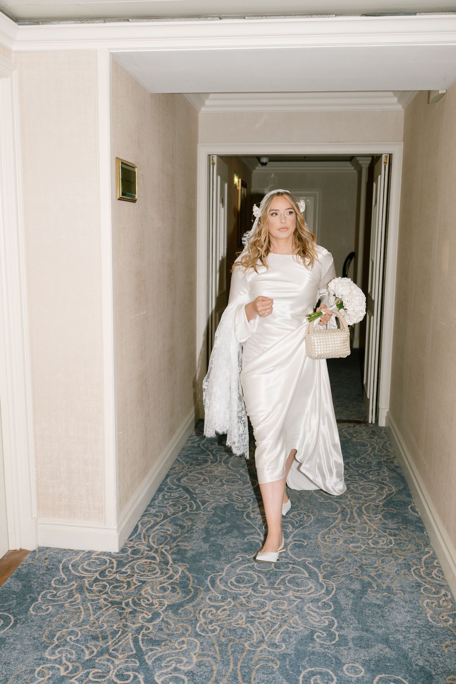 A series of photos showing someone in white running down a hotel hallway with a patterned blue carpet.