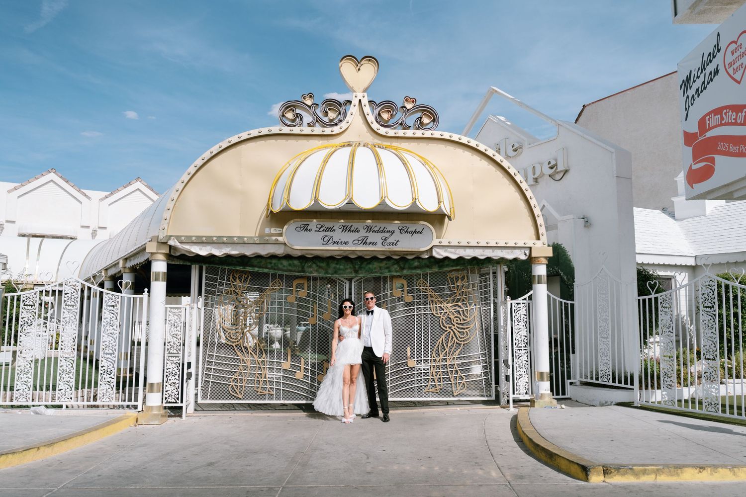Exterior view of a white wedding chapel with ornate dome architecture in Las Vegas.