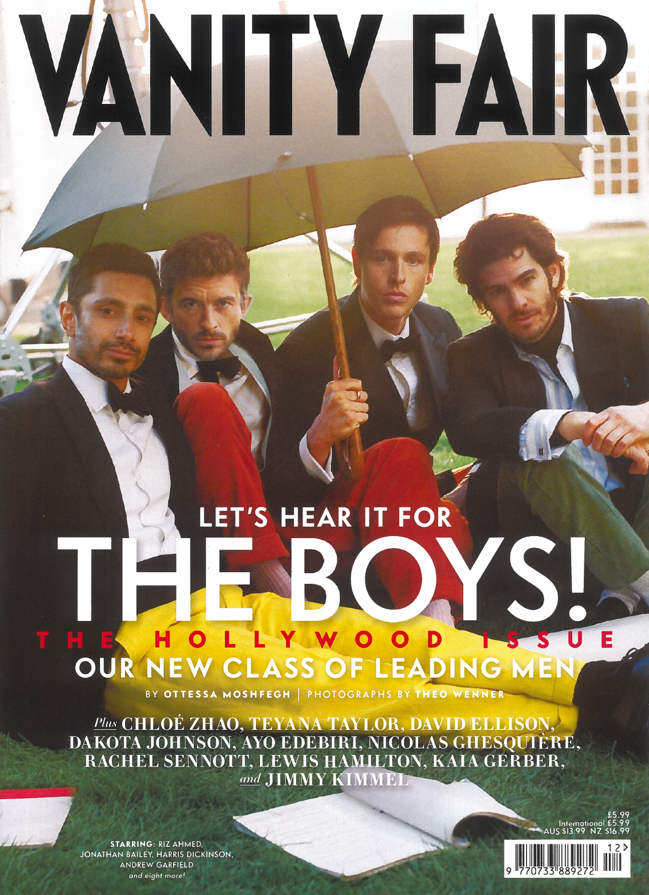 Vanity Fair magazine cover showing four men in suits and bow ties standing under a yellow umbrella.