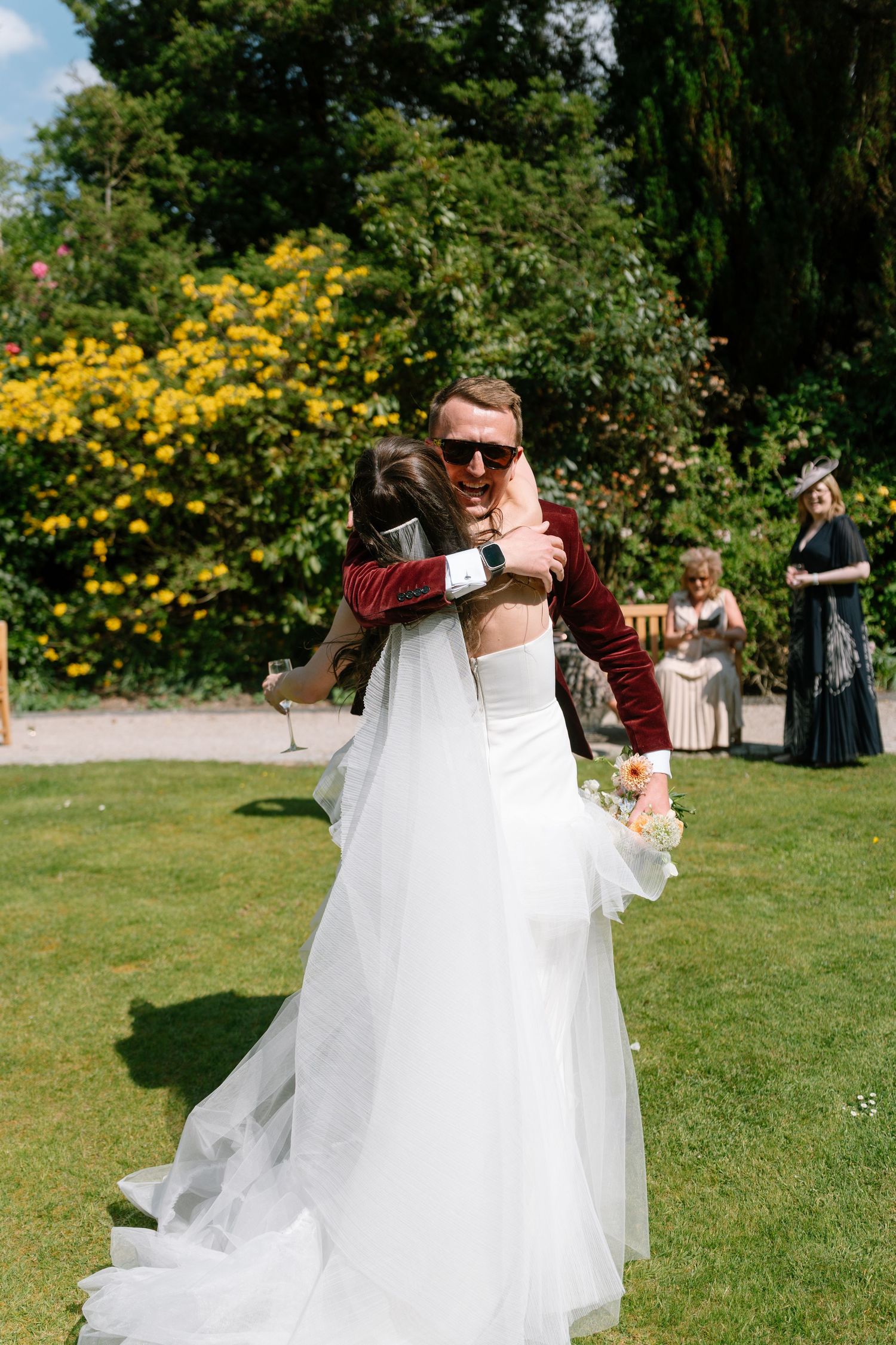 A white wedding dress flows dramatically during an outdoor photo session.