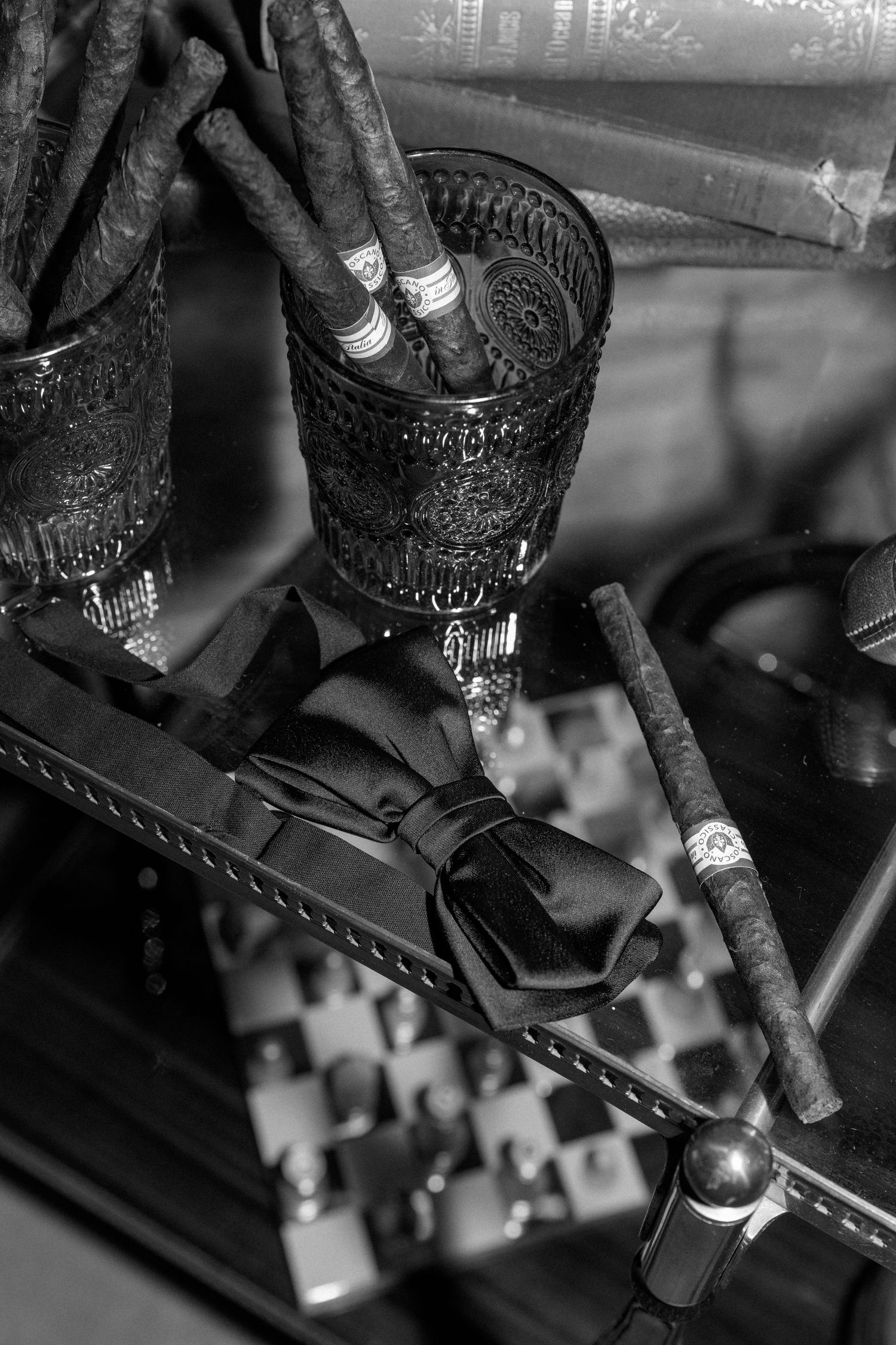 Black and white macro shots of mechanical components showing intricate details of metal parts and gears.