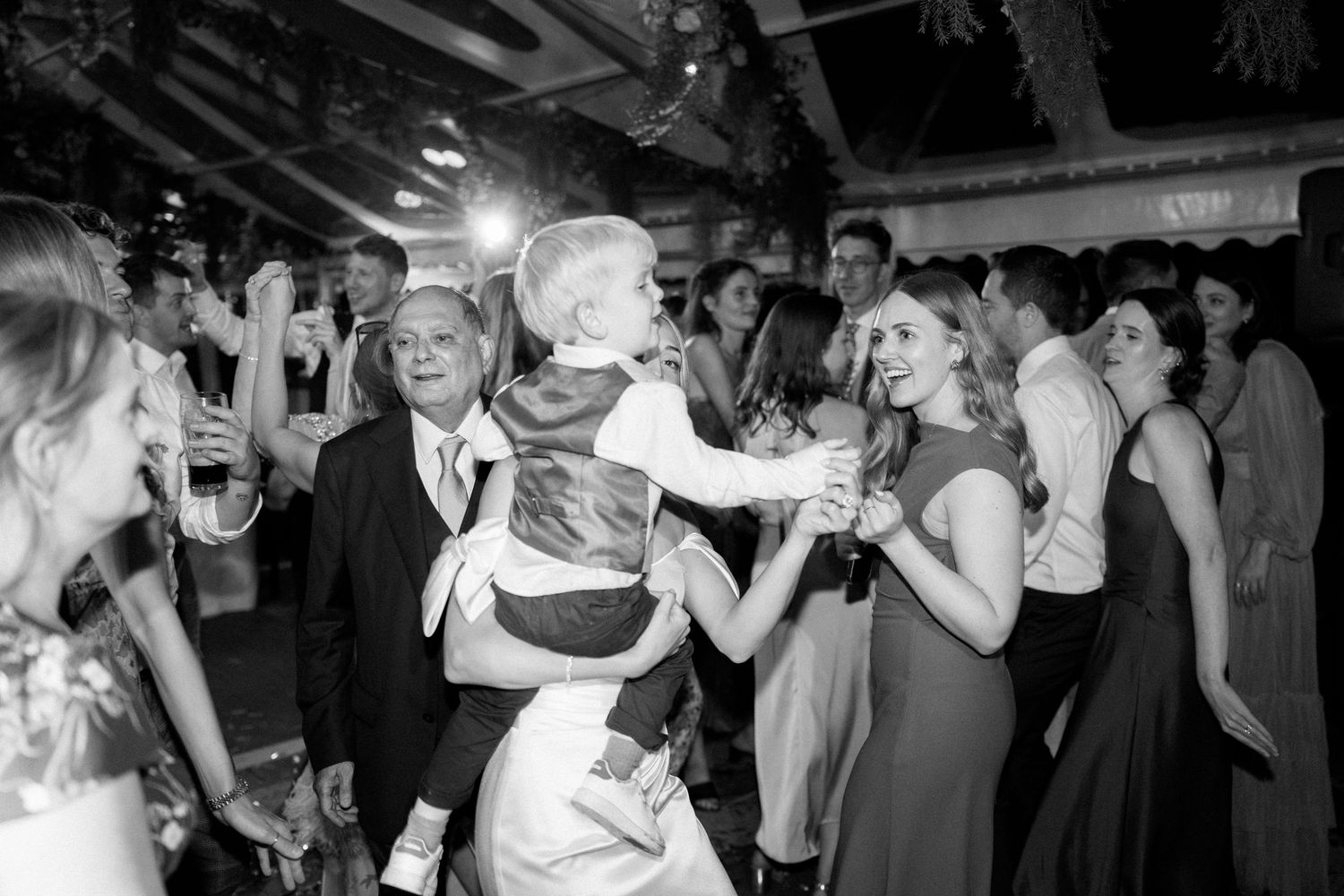 Dance floor filled with energetic party guests enjoying the celebration.