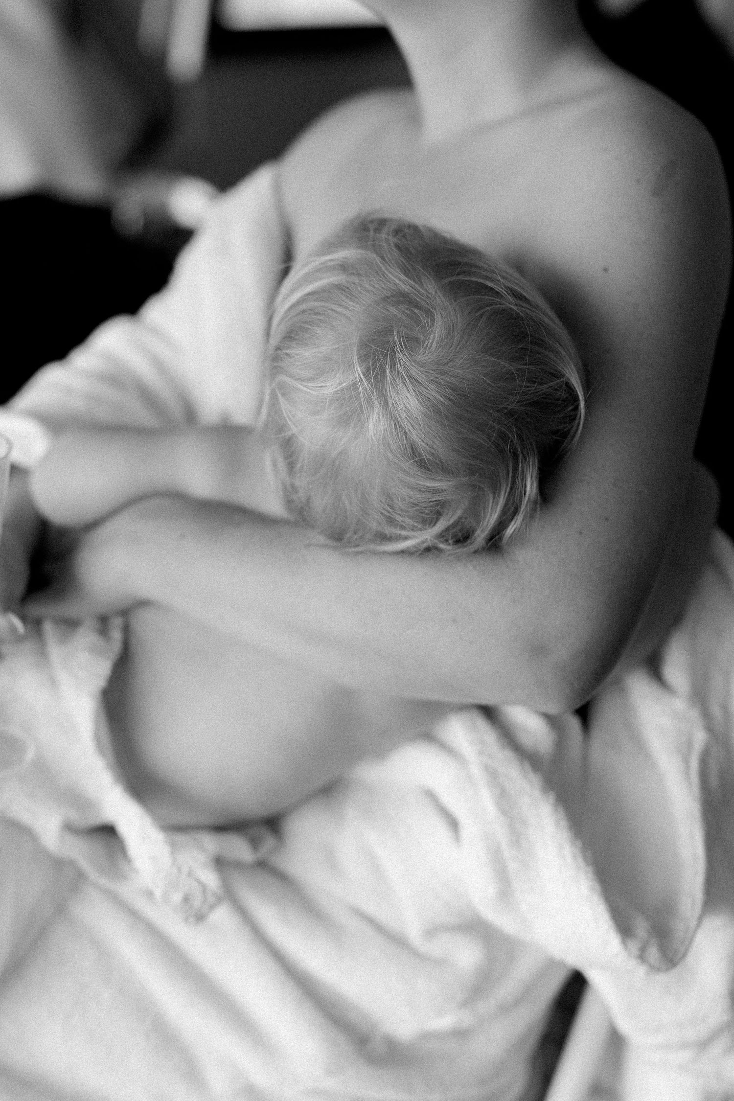 A soft, artistic black and white photograph capturing quiet moments of preparation.