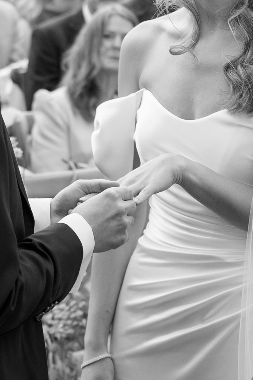 Close-up detail of elegant white wedding dress fabric.